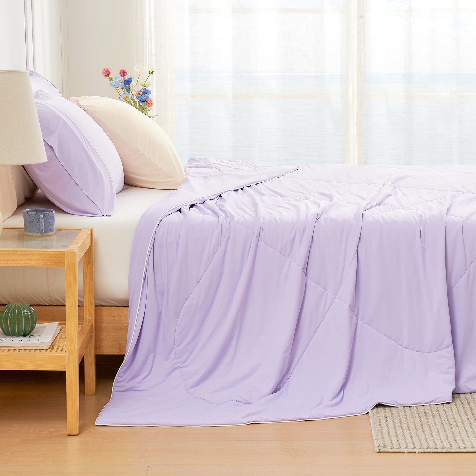 Cozy Bliss cooling comforter in light purple on bed, breathable bedding for hot sleepers #Color_Purple
