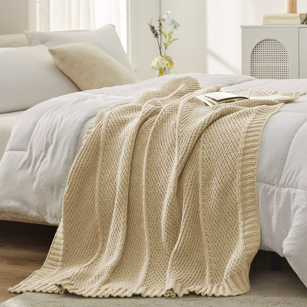 Chevron Chenille Knit Throw Blanket in Beige styled on a bed, adding warmth and a neutral elegant touch. #color_Beige