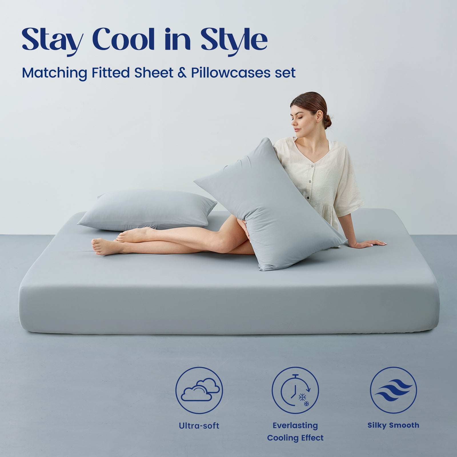 Woman lying on a cooling sheet set with matching fitted sheet and pillowcases set.#color_Light Grey