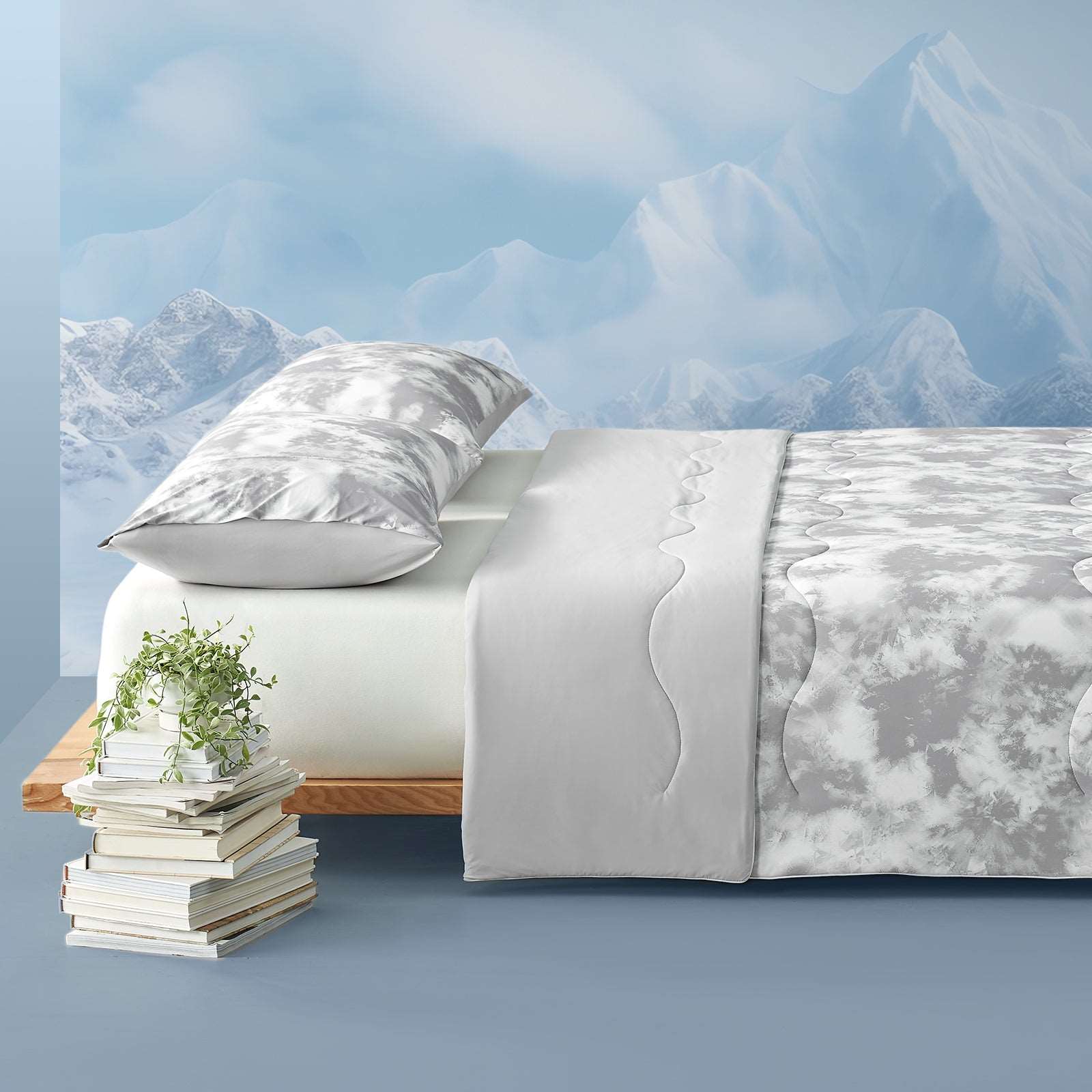 Cozy Bliss tie-dye cooling comforter on bed, mountain backdrop #color_Tie Dye Grey
