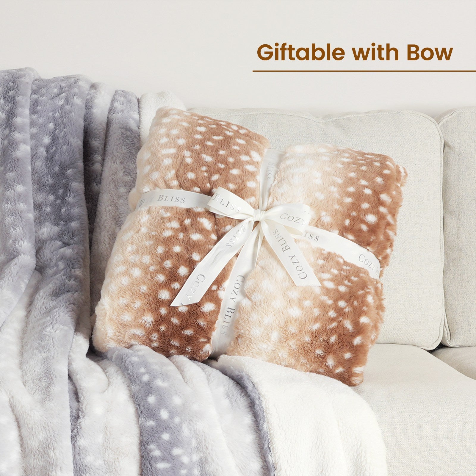 Deer print faux fur blanket, giftable with bow. Featuring cozy and soft material for home decor.