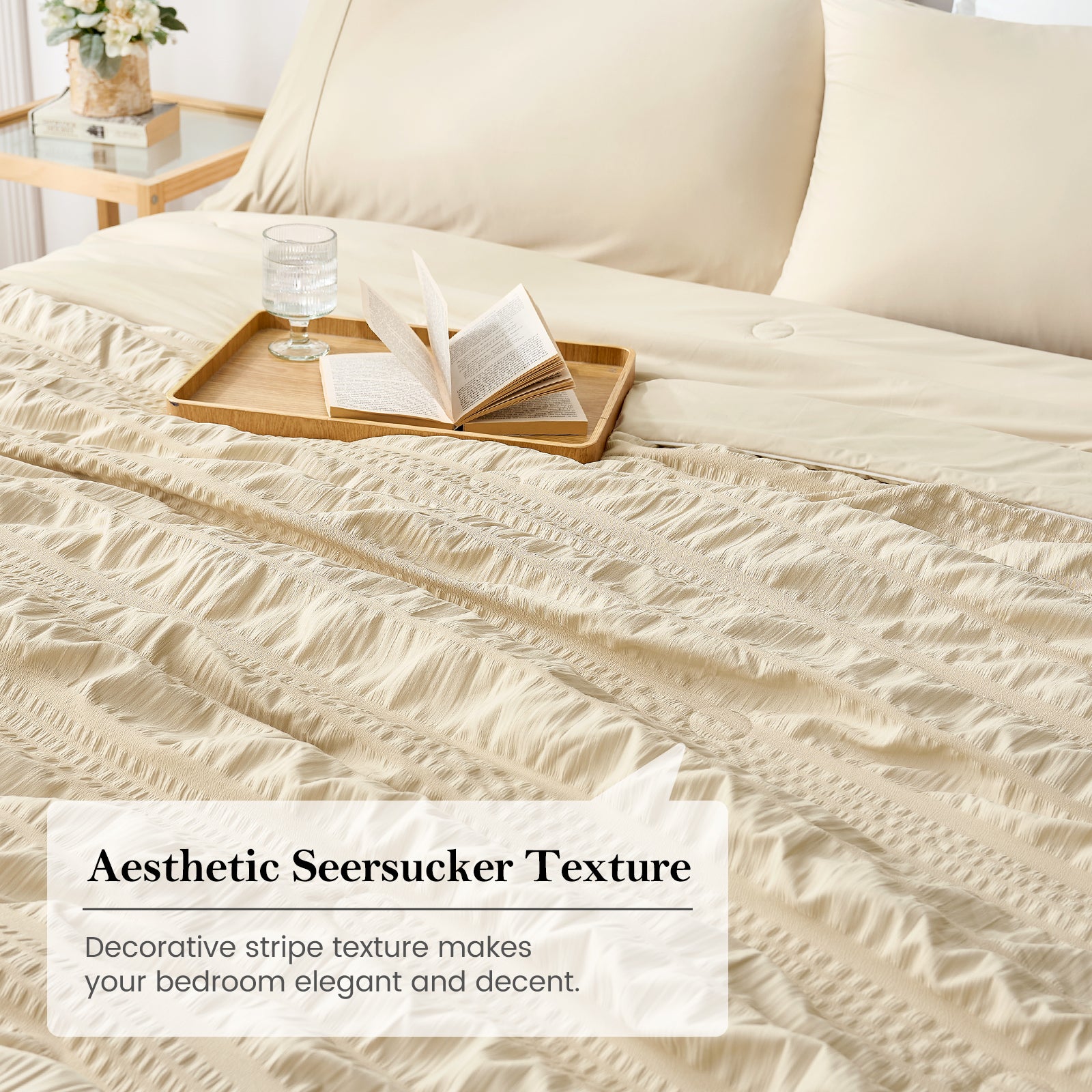 Khaki seersucker cooling comforter on bed with tray and book, soft breathable textured bedding in a cozy bedroom setting.#color_khaki