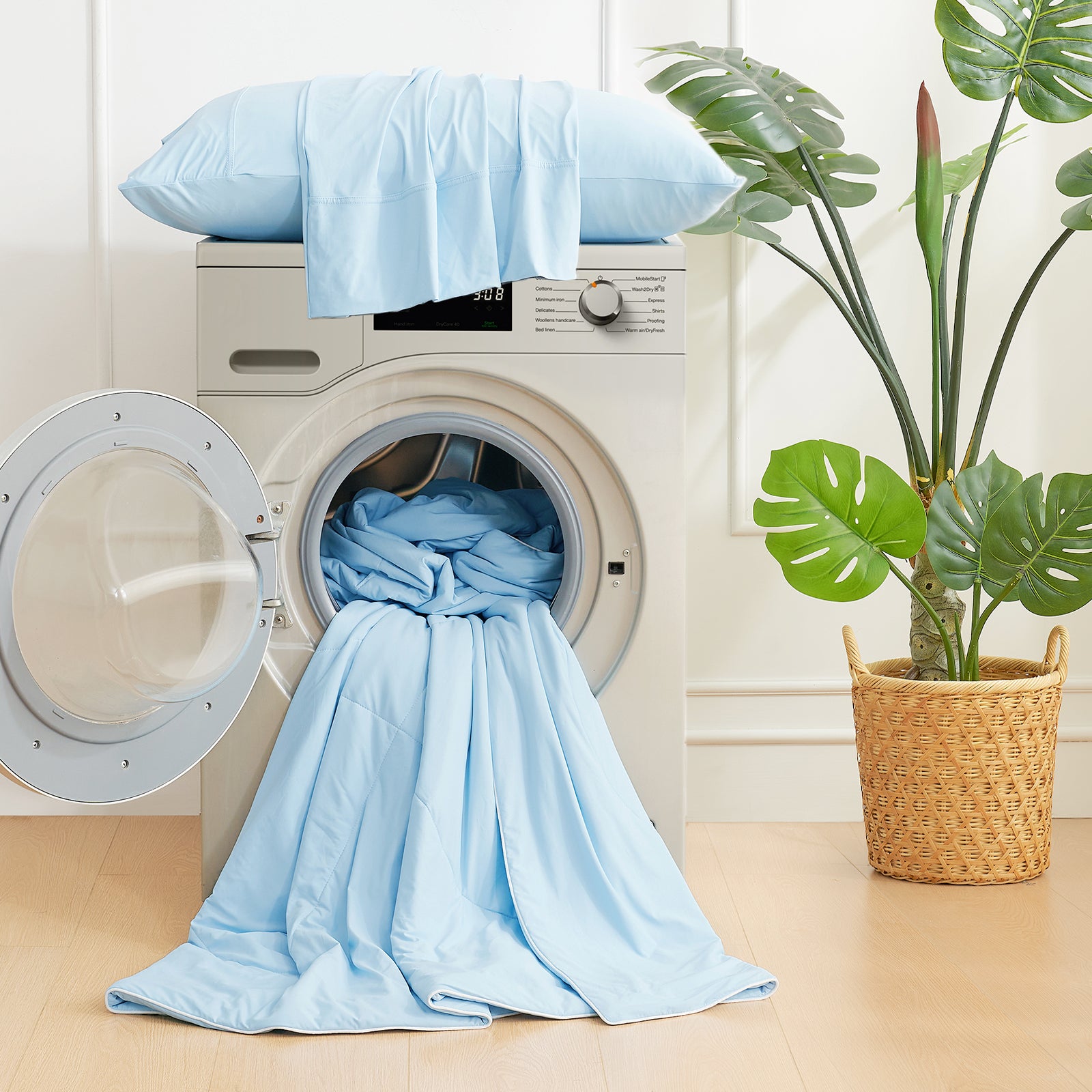 Cozy Bliss light blue cooling comforter in washing machine, easy-care bedding #Color_Sky Blue