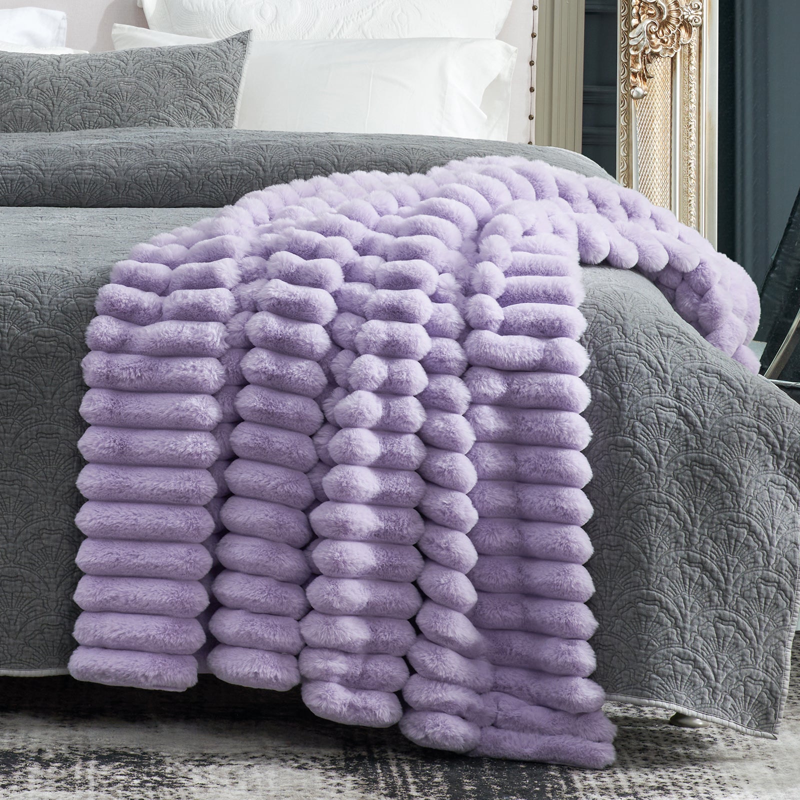 Lavender faux fur throw blanket on bed. Cozy Bliss, ultra-soft and perfect for adding warmth to home. #color_Lavender Purple