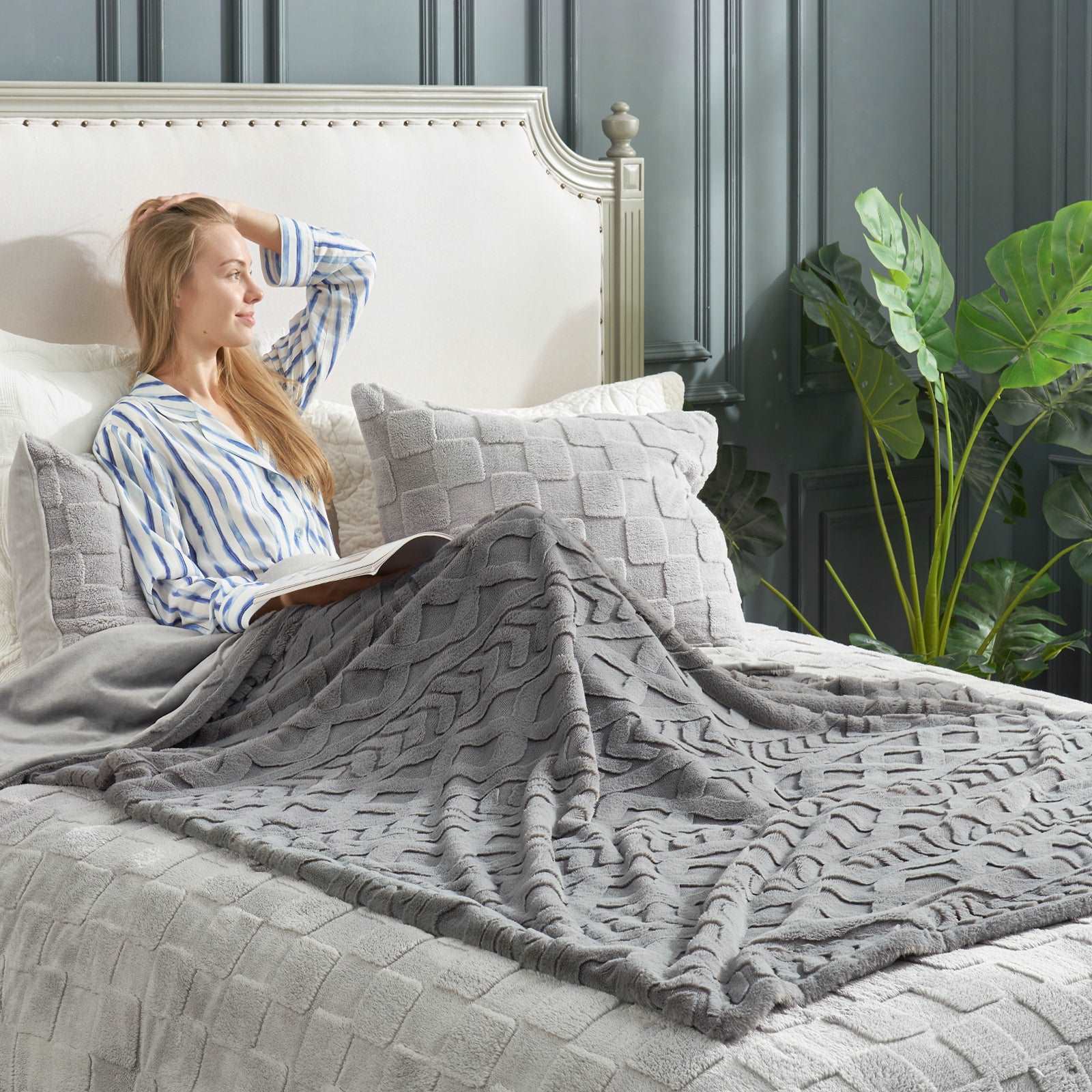 Woman reading under gray cable knit blanket #color_Grey