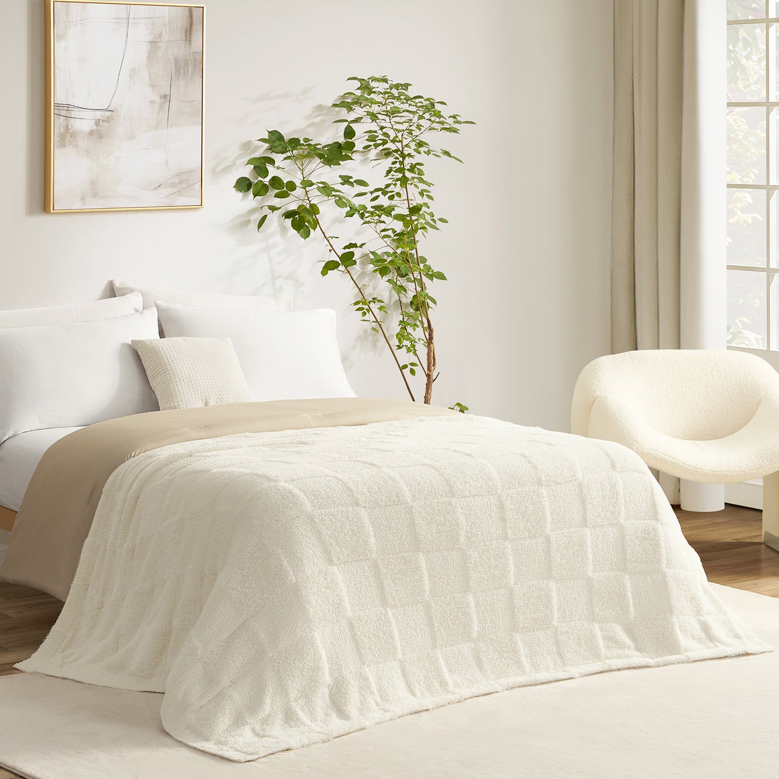 Checkered Faux Fur Feather Yarn Throw Blanket in Ivory styled on a bed, creating a clean and cozy layered look. #color_Ivory