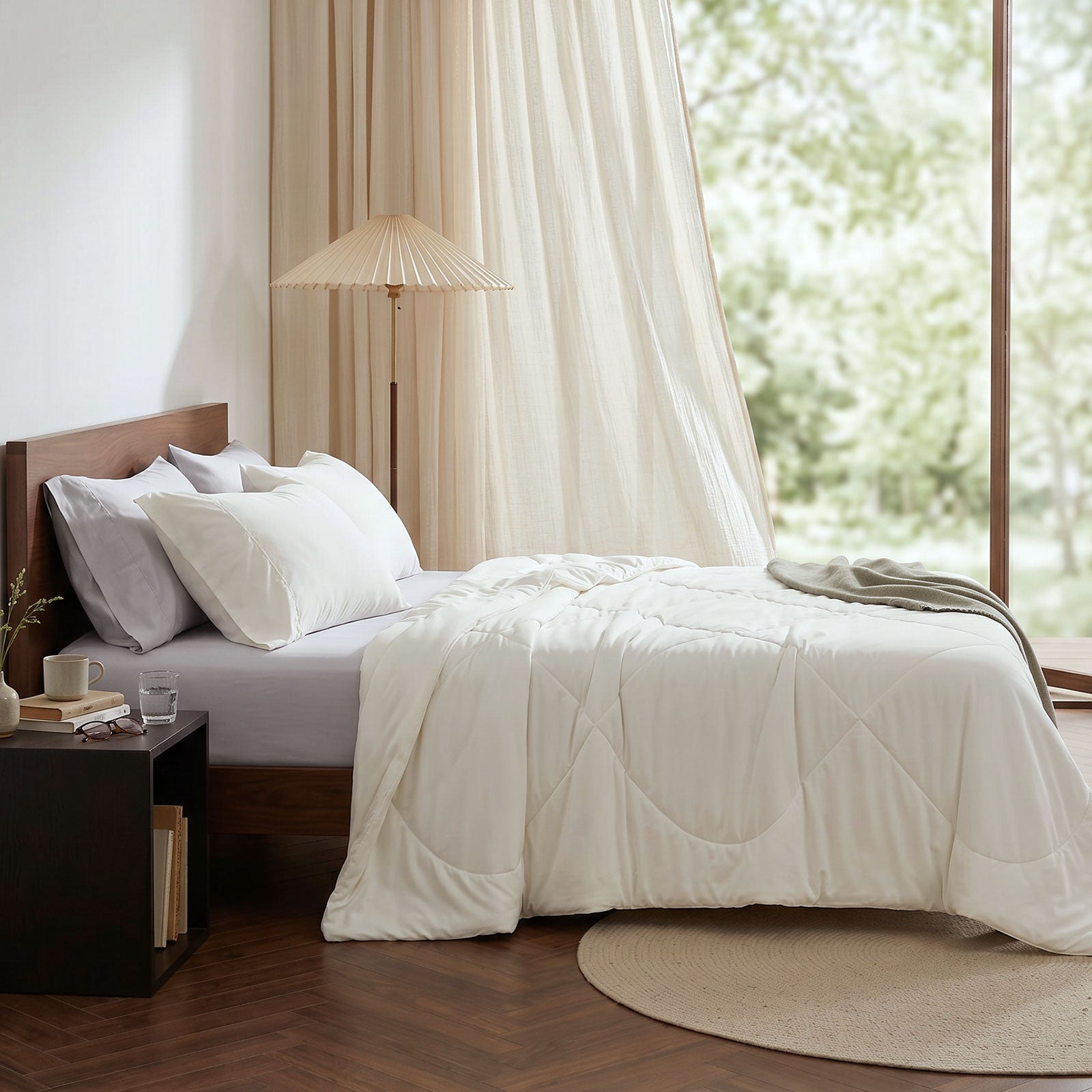 Cozy Bliss cooling comforter on bed in side view. Breathable, soft fabric for hot sleepers. #Color_Off White