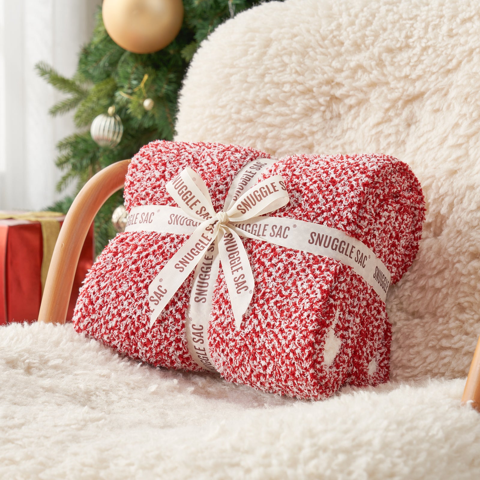 Heather Feather Yarn Throw Blanket in Christmas red neatly folded with ribbon, a perfect gift idea for holidays, housewarming or special occasions. #Color_Christmas Red