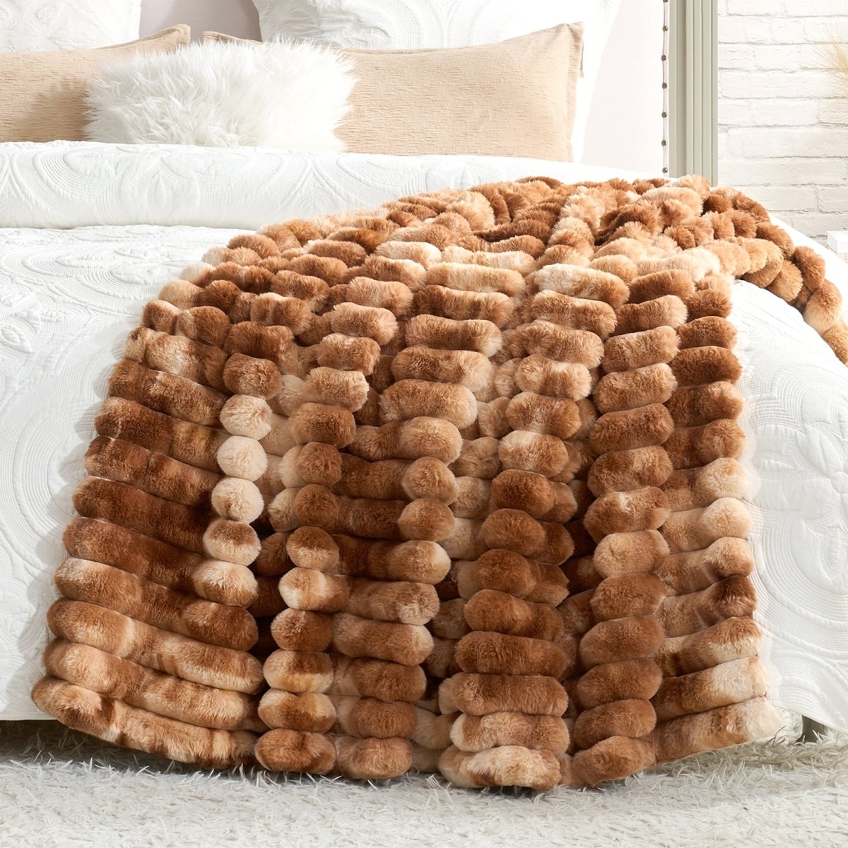 Brown textured blanket draped over a bed with white bedding. #Color_Tie-dye Brown
