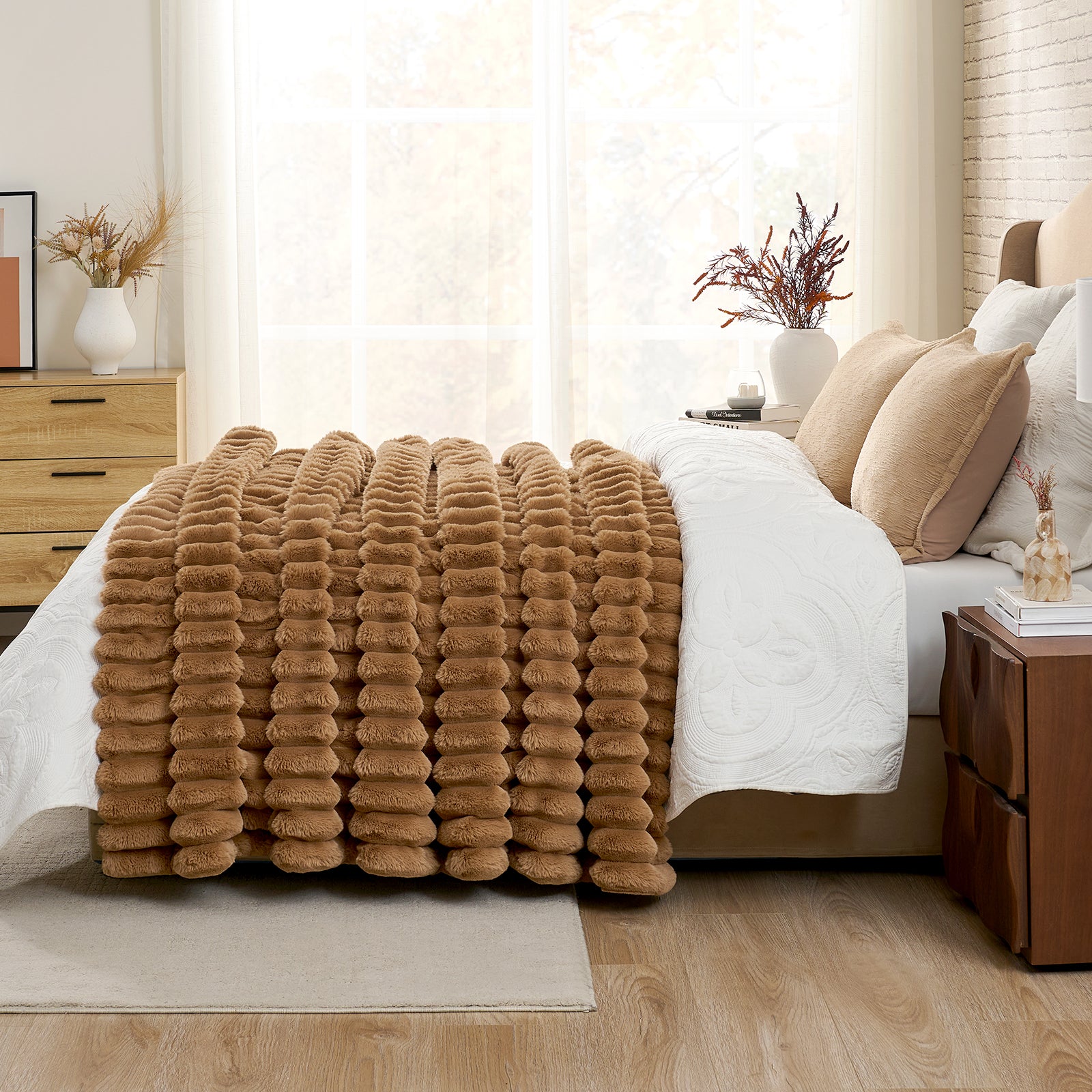 Brown textured blanket on a bed in a bedroom setting with curtains and decor. #color_Toasty Brown