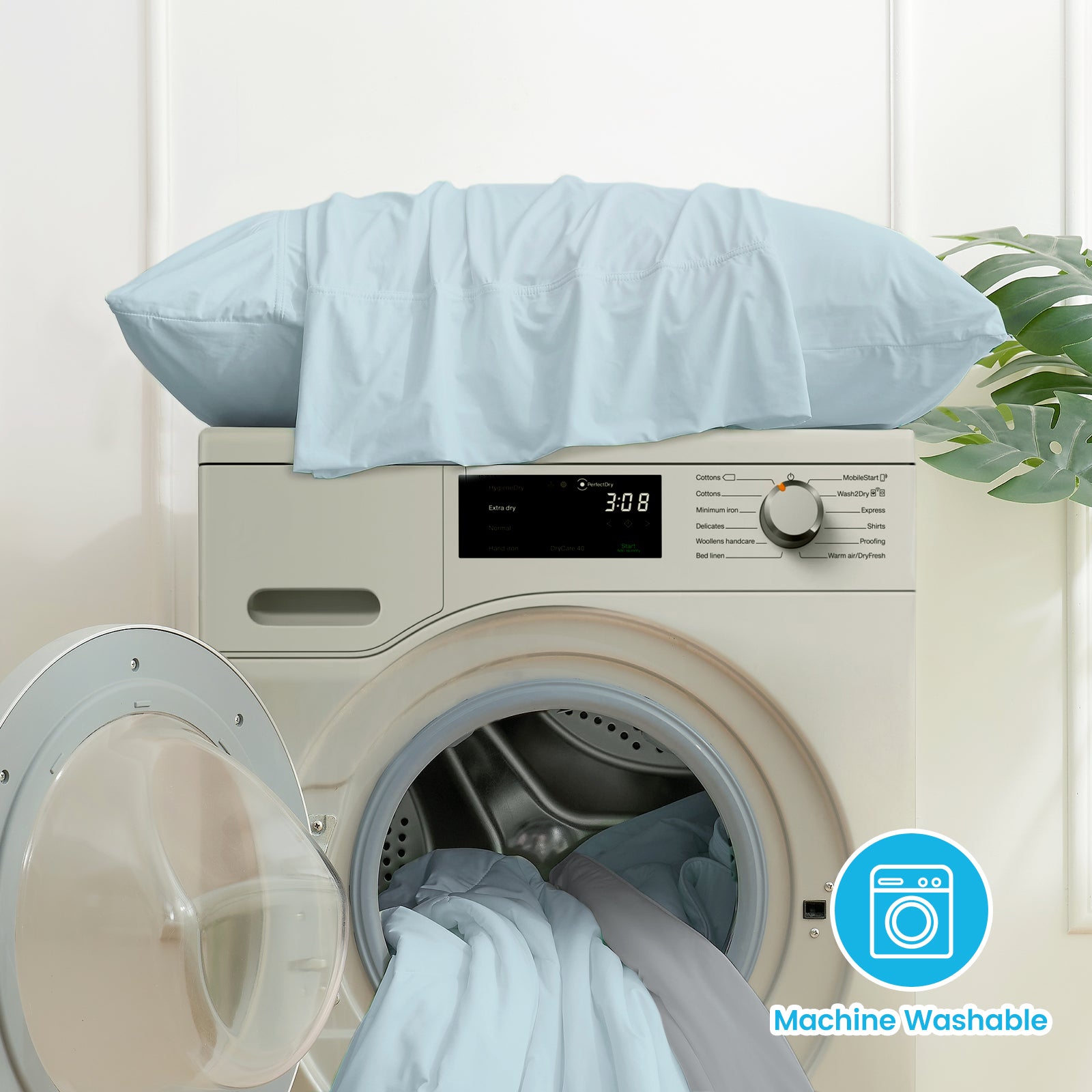 Machine-washable light blue cooling pillowcases set on a washing machine, easy care, for comfortable sleep #color_Blue