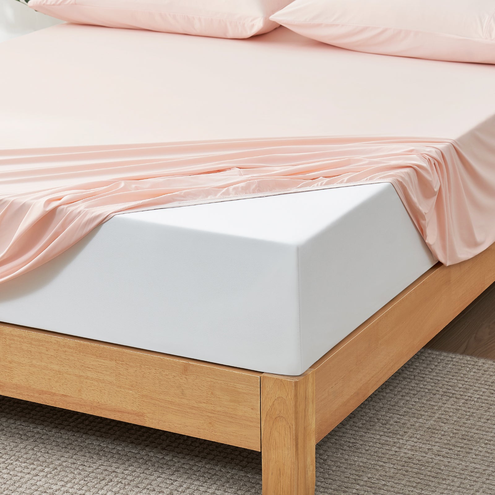 Blush pink cooling fitted sheet set on a bed, ultra-soft and breathable #Color_Pink
