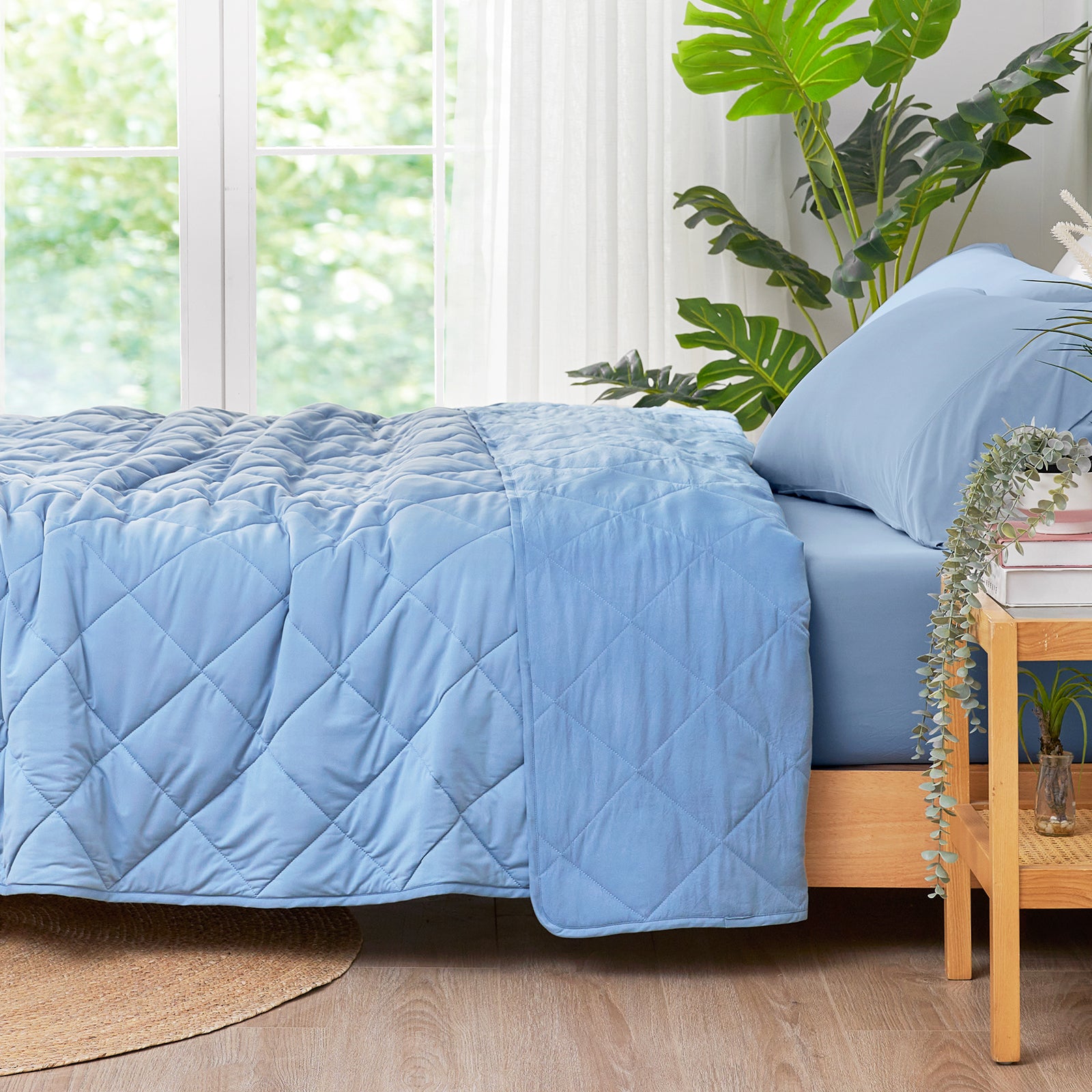 Light blue Chill Weave Cooling Blanket on bed, diamond quilted design, breathable for hot sleepers #Color_Dark Blue