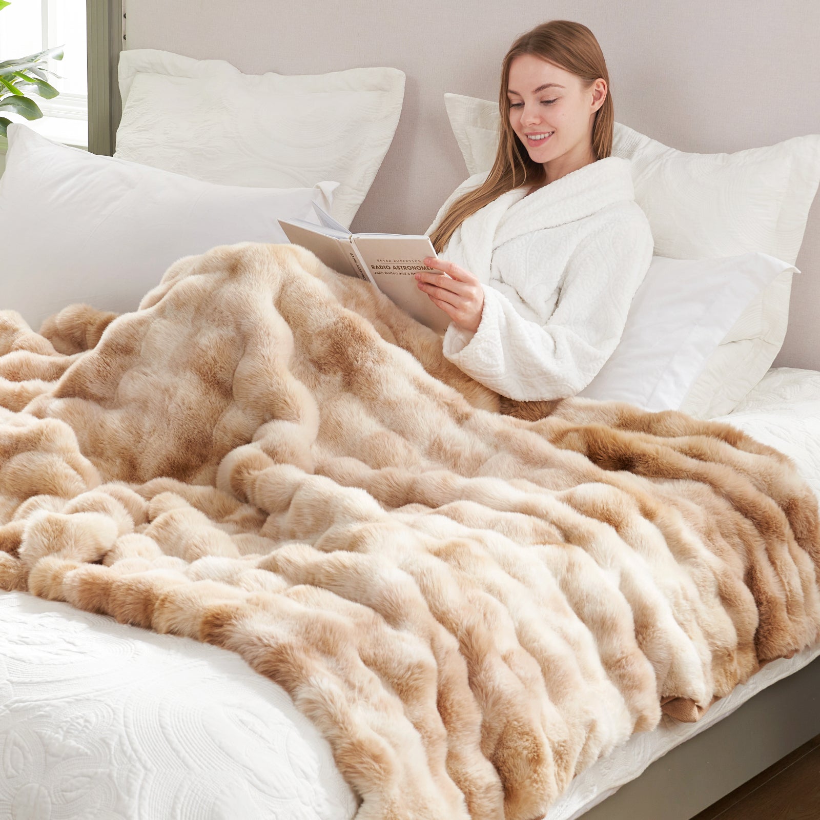 Cozy Bliss faux fur throw blanket, woman relaxing in bed with a book, cozy comfort. #Color_Tie-dye Beige