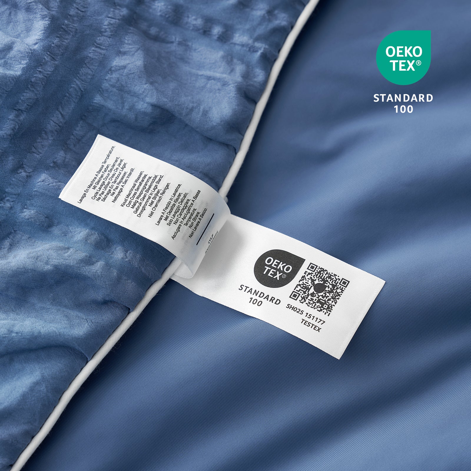 OEKO-TEX label on a blue fabric background #color_Denim Blue