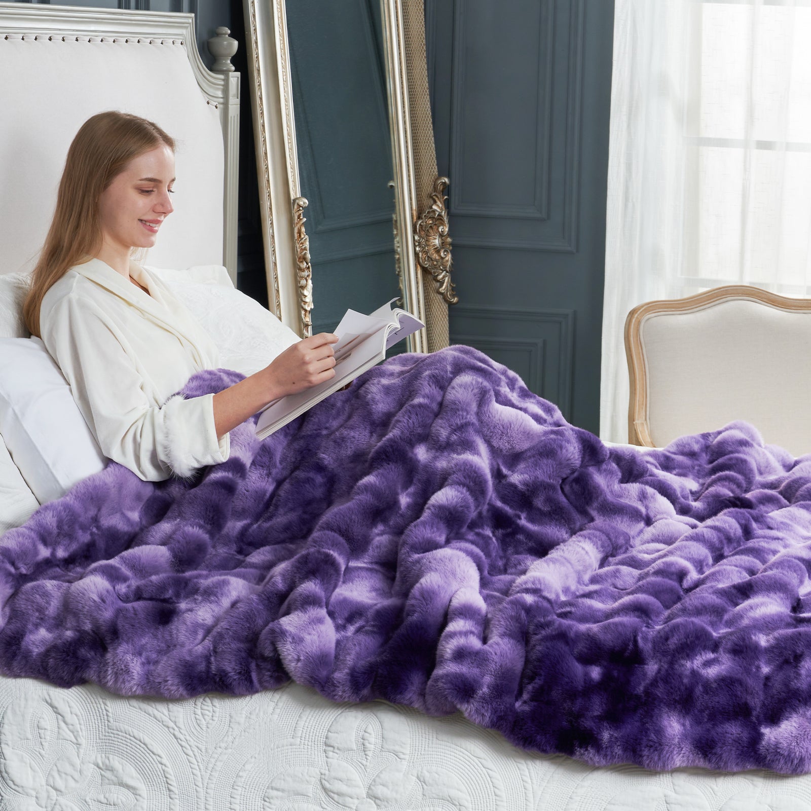 Cozy Bliss purple faux fur blanket, woman reading on bed. Luxurious soft blanket for a cozy bedroom #color_Tie-dye Purple