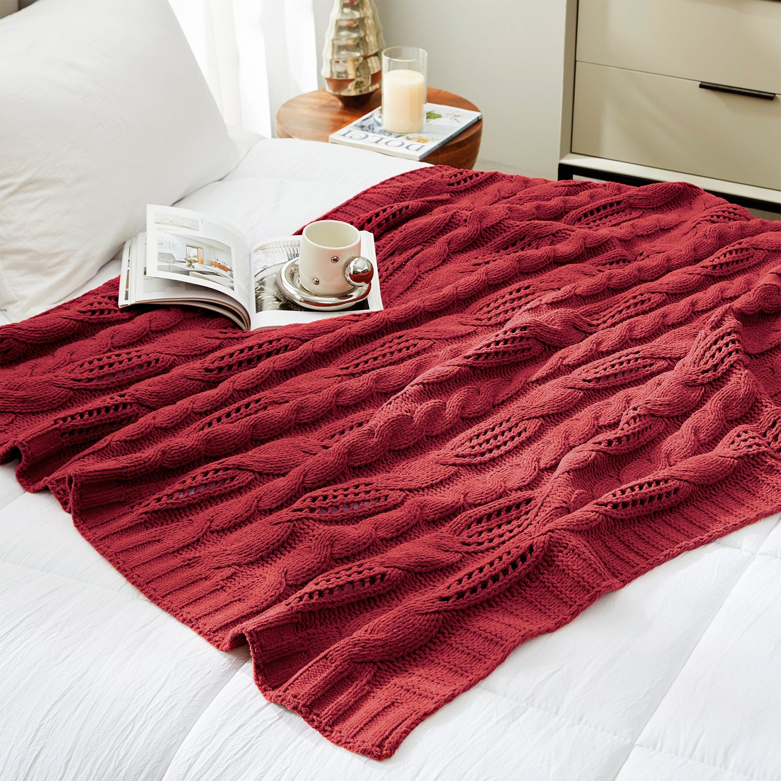 Chenille Cable Knit Throw Blanket in Red styled on a bed in a modern bedroom, adding warmth and a bold cozy look. #color_Christmas Red