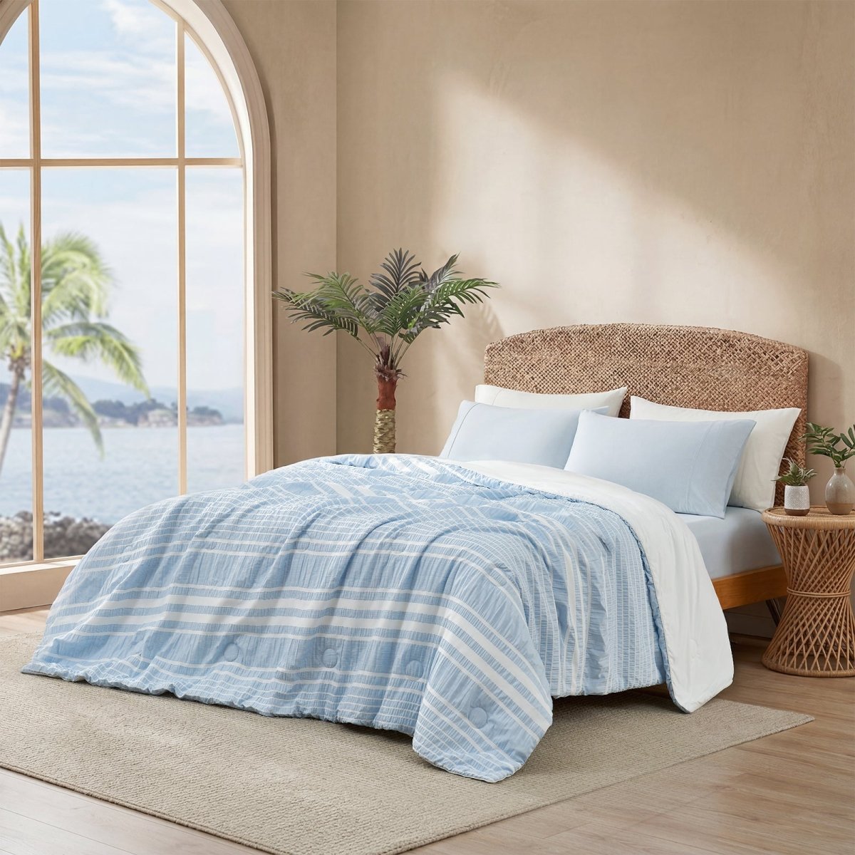 Cozy Bliss cationic dyed striped seersucker cooling comforter in Sky Blue layered on a bed #color_Sky Blue