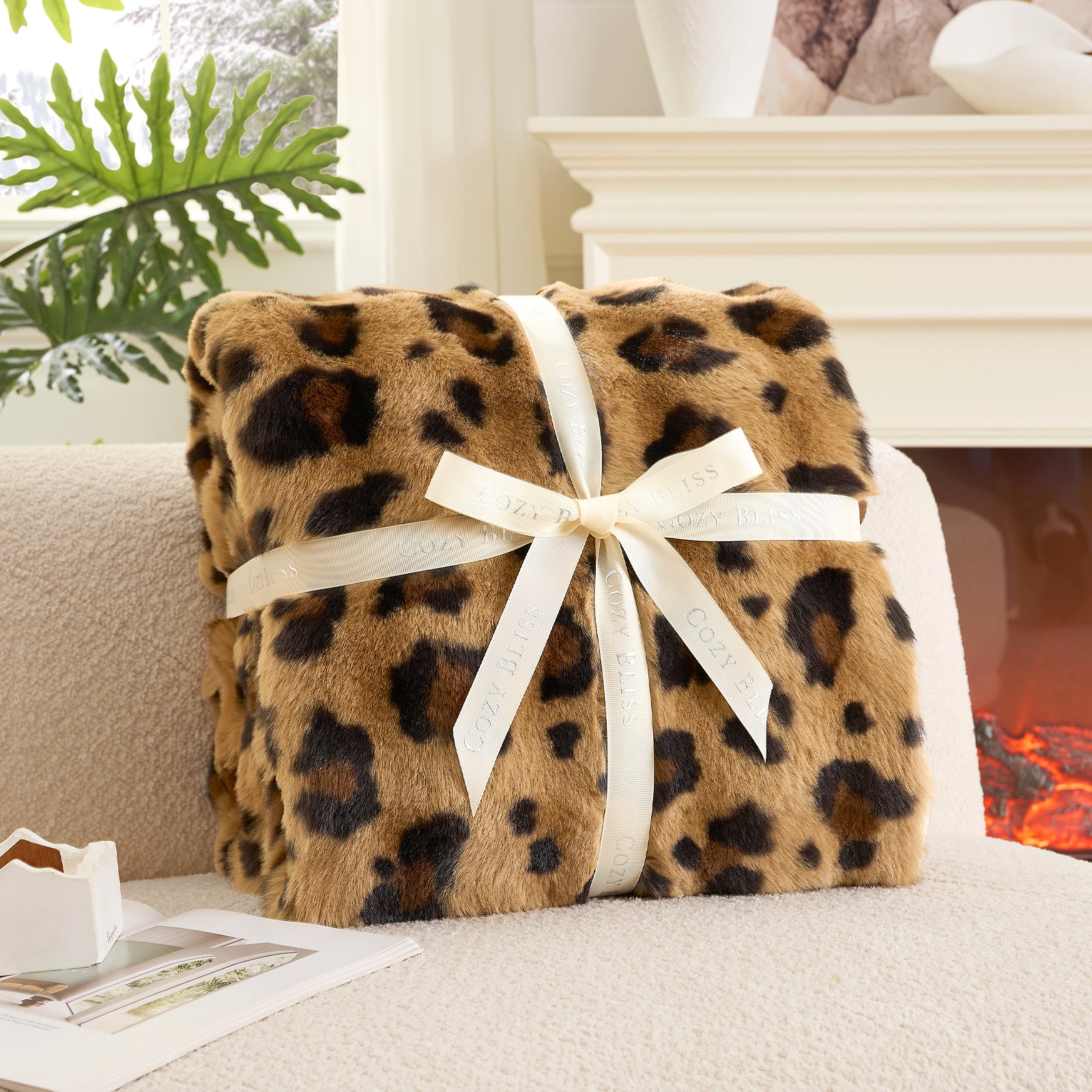 Fluffy brown leopard blanket with a bow on a armchair. #Color_ Brown Leopard