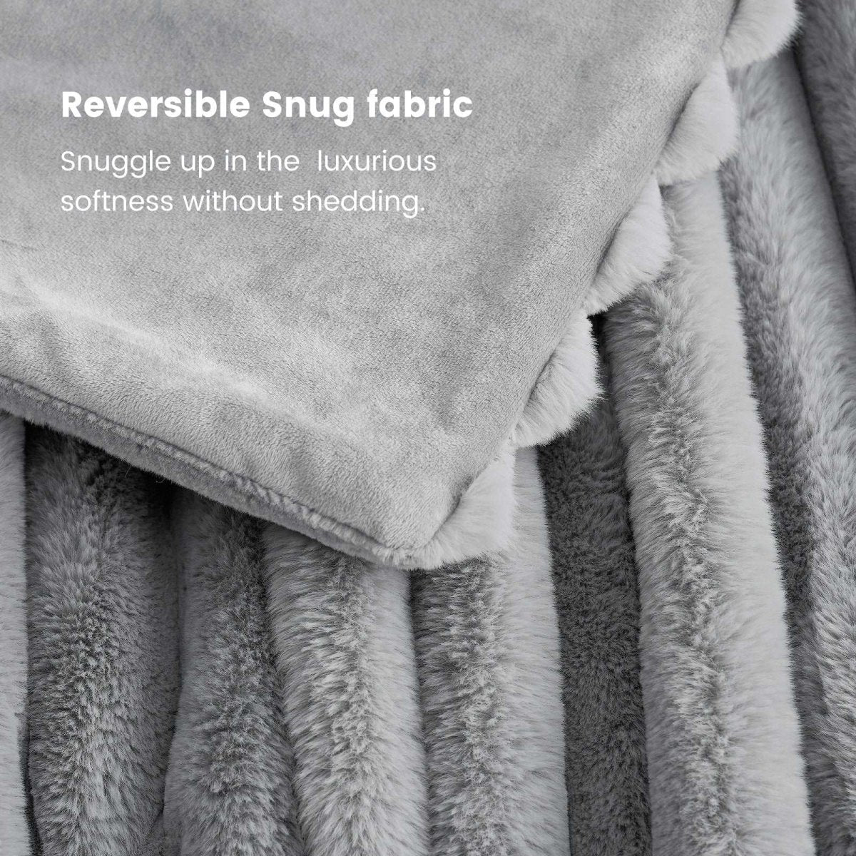 Close-up of the fabric of Cozy Bliss grey faux fur blanket, reversible snug fabric, soft and cozy for ultimate comfort. #color_Grey