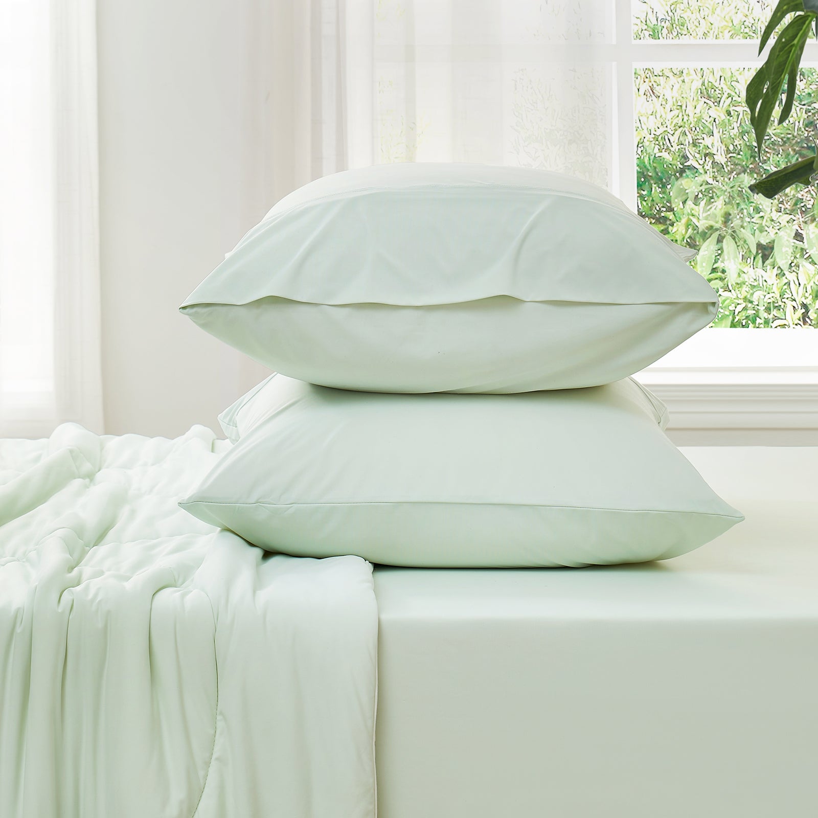 Mint green cooling sheet set on bed. Ultra-soft, breathable Cozybliss bedding for cozy sleep. #Color_Light Mint Green
