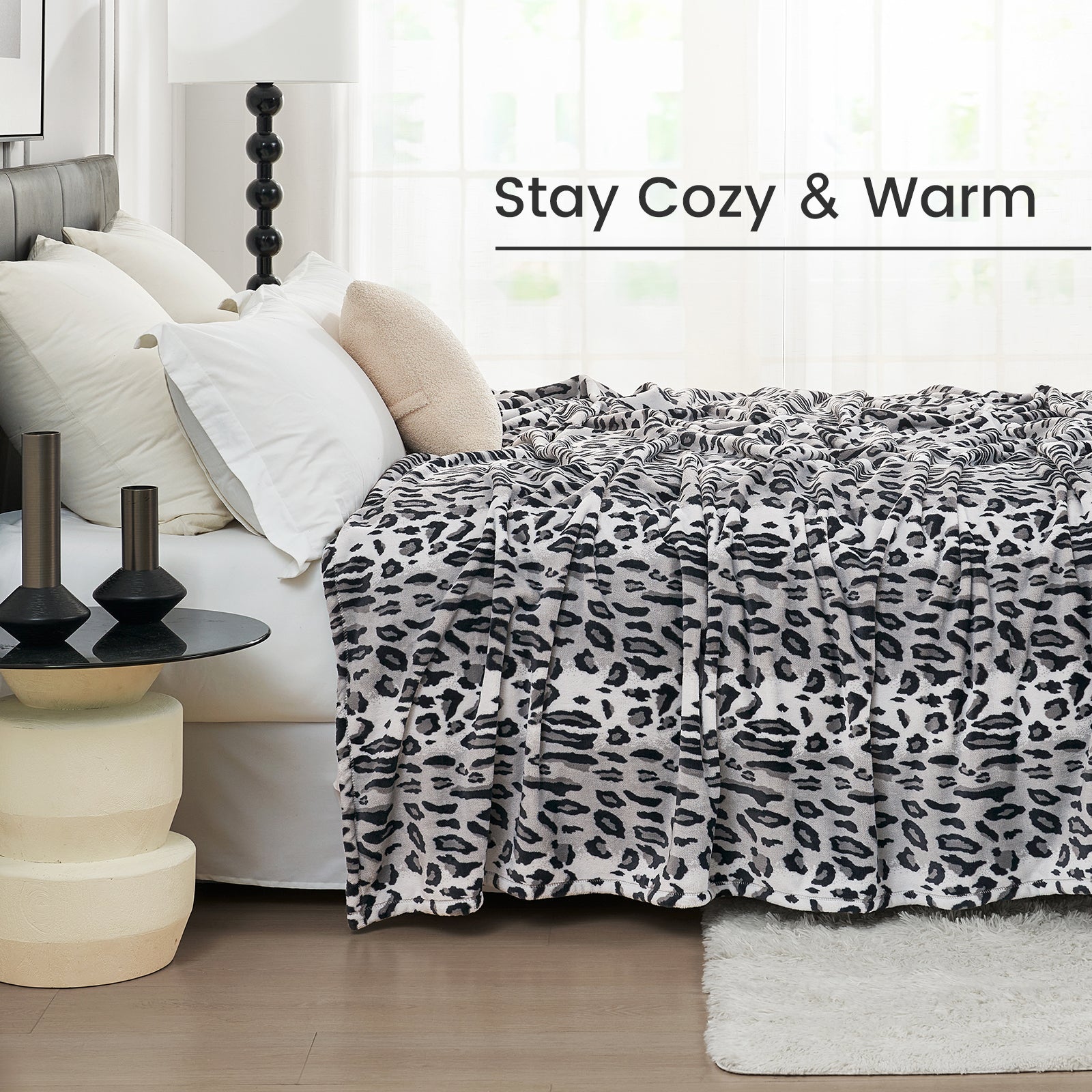 Cozy leopard print blanket on a bed, Stay Cozy & Warm text, ultra-soft cozy blanket, cooling comforter #color_Silvery Leopard