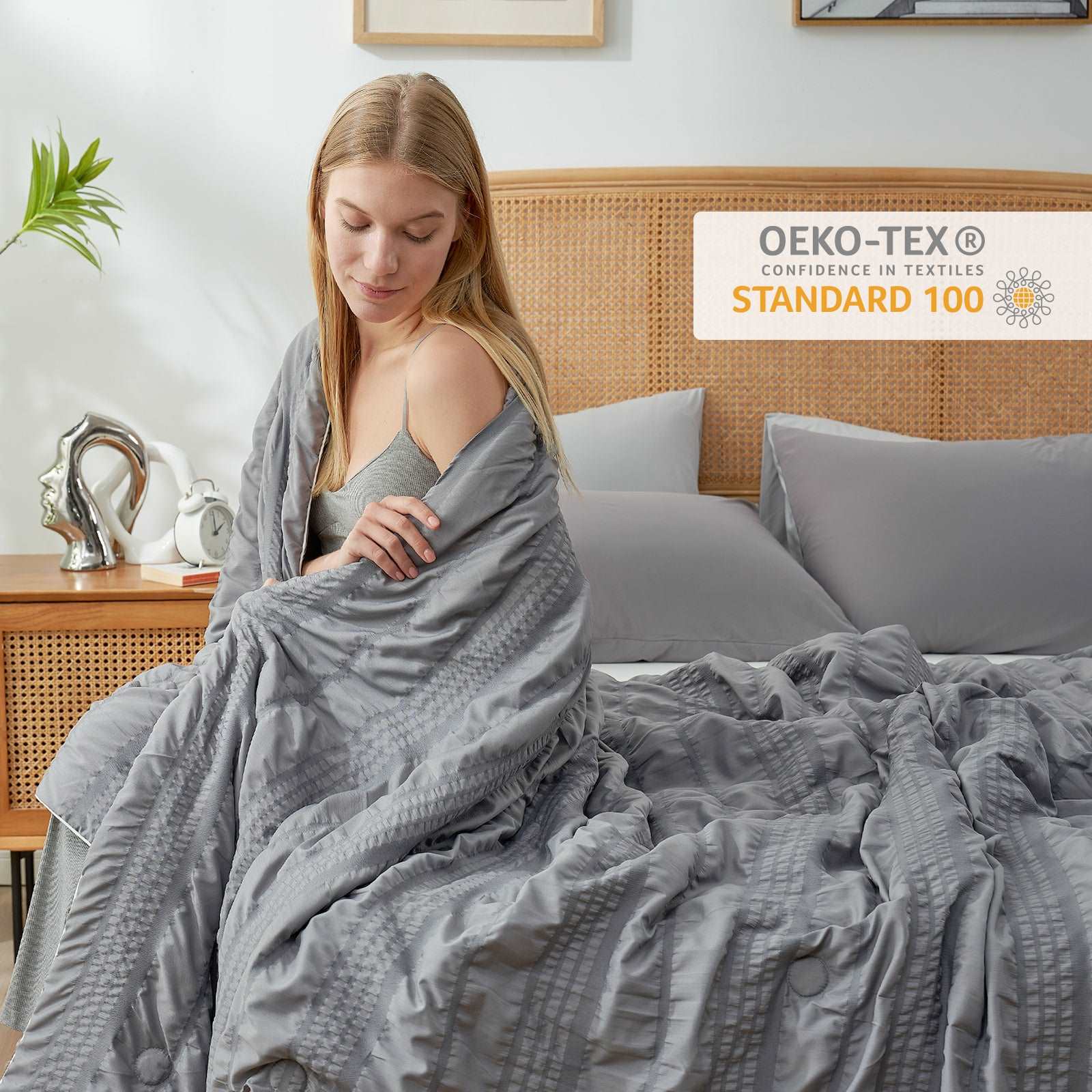 Woman wrapped in Cozy Bliss gray cooling blanket, OEKO-TEX certified #color_Dark Grey