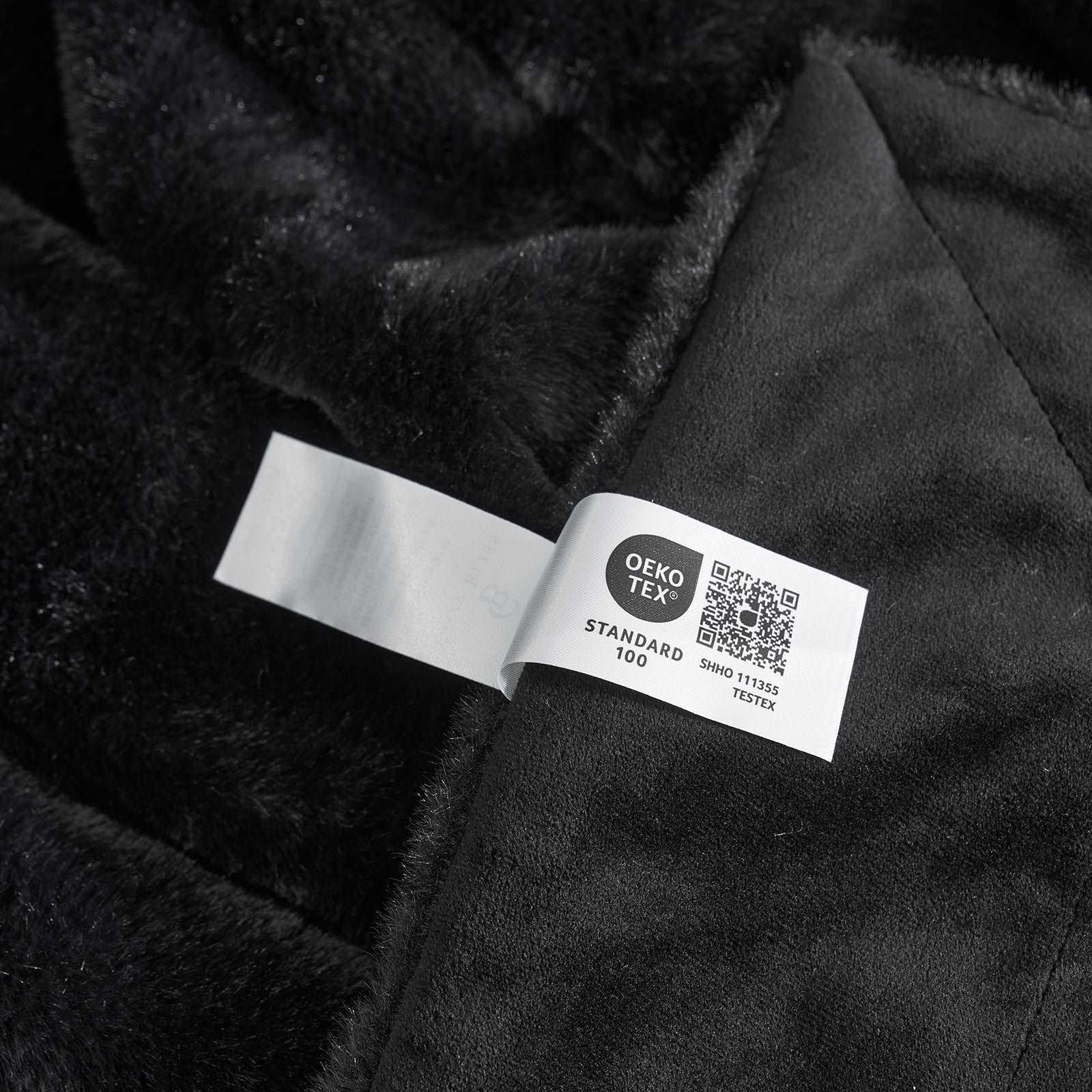 CozyBliss black faux fur blanket detail, OEKO-TEX certified for safe and cozy comfort. #color_Black