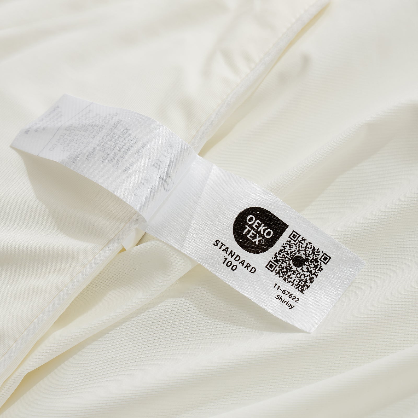 OEKO-TEX certified cooling comforter label, showing Standard 100 certification for safe and soft bedding. #Color_Off White