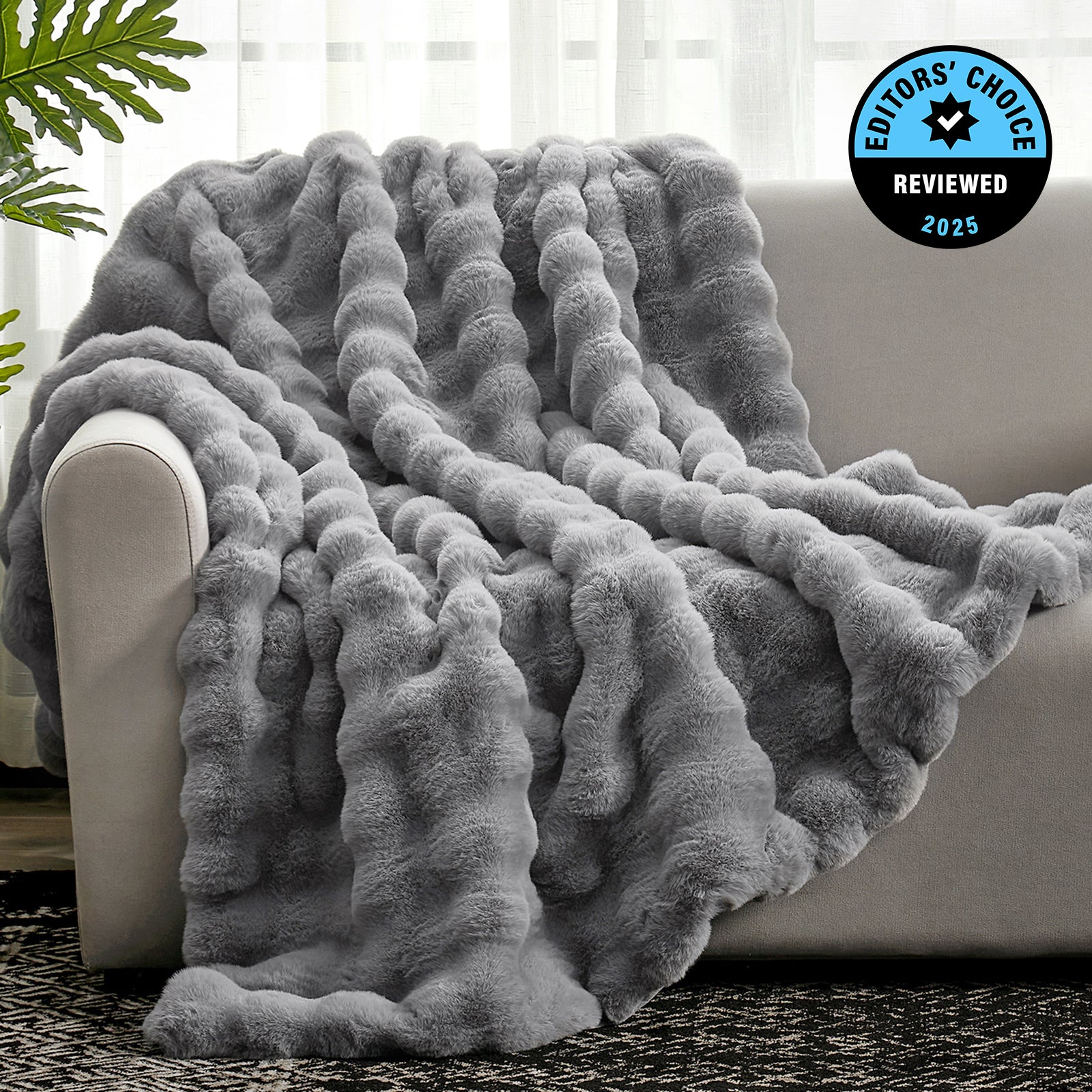 Woman with gray Bubble Faux Fur Throw Blanket - Cozy Bliss #color_Grey