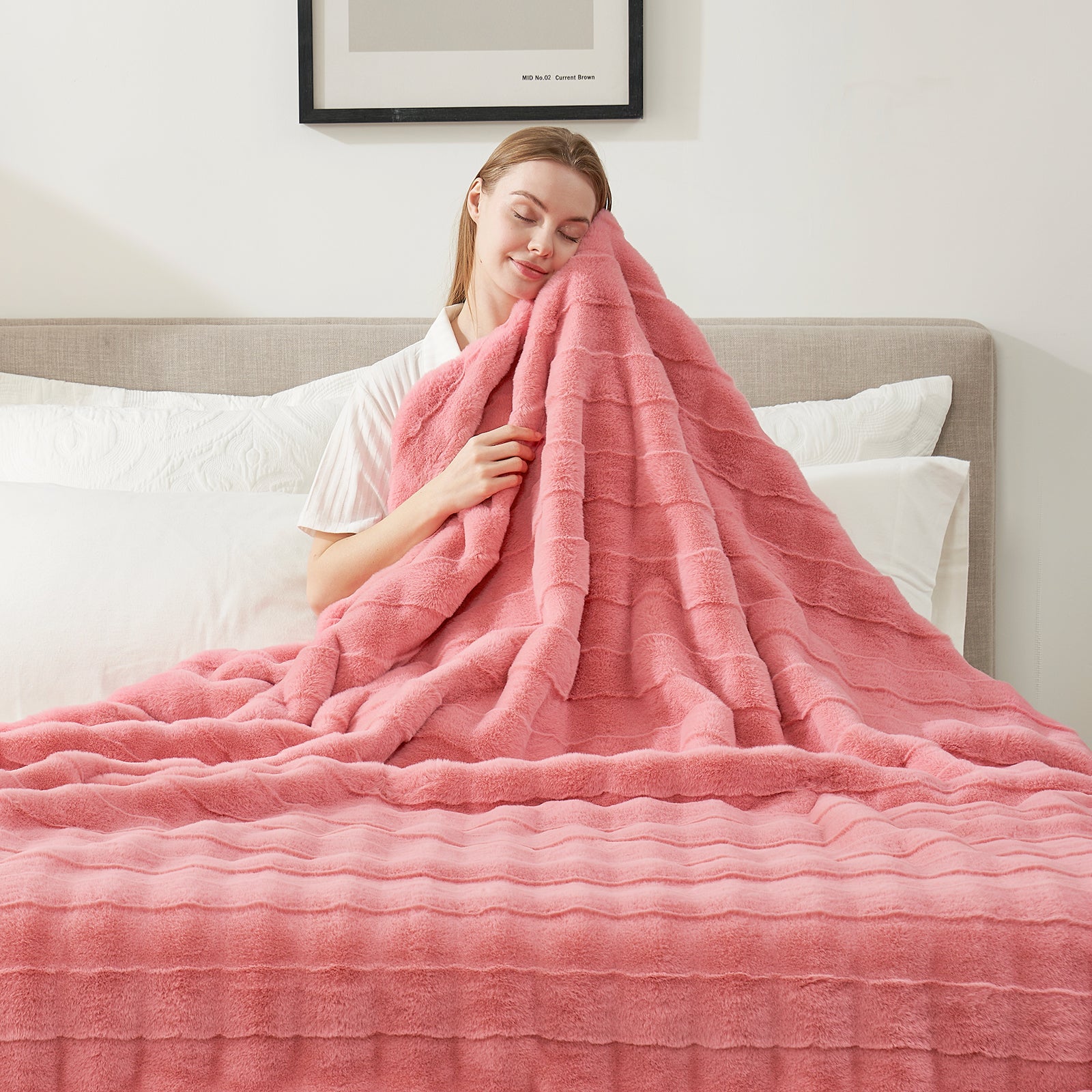 Woman relaxing with pink cross-striped faux fur blanket #color_Hot Pink