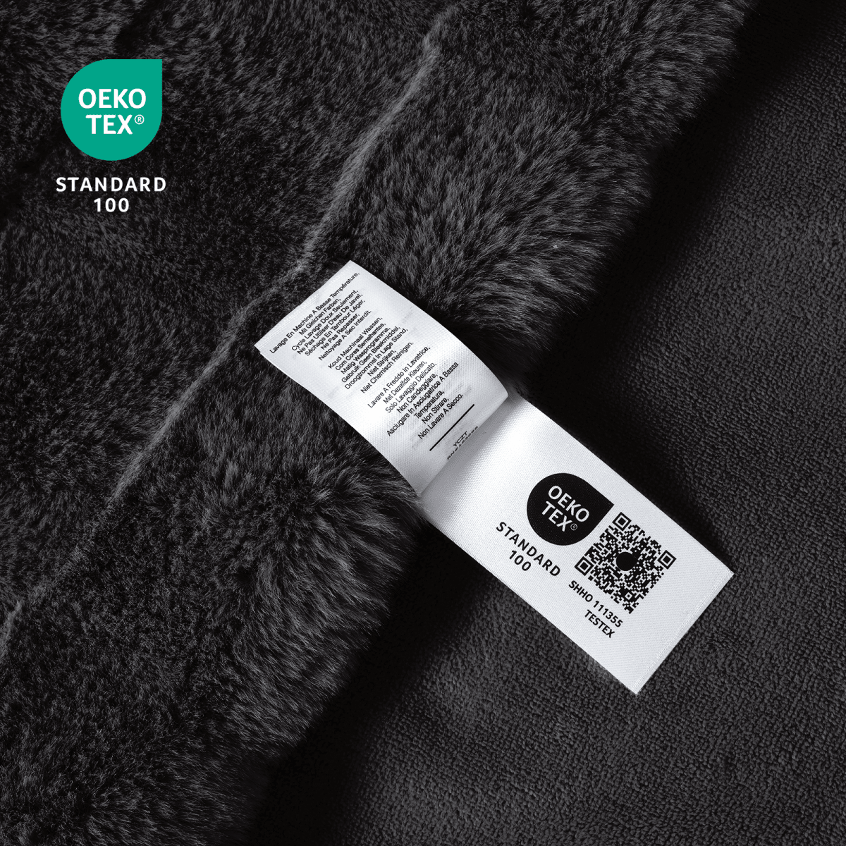 Close-up of OEKO-TEX certified cross-striped faux fur black blanket fabric. #Color_Black