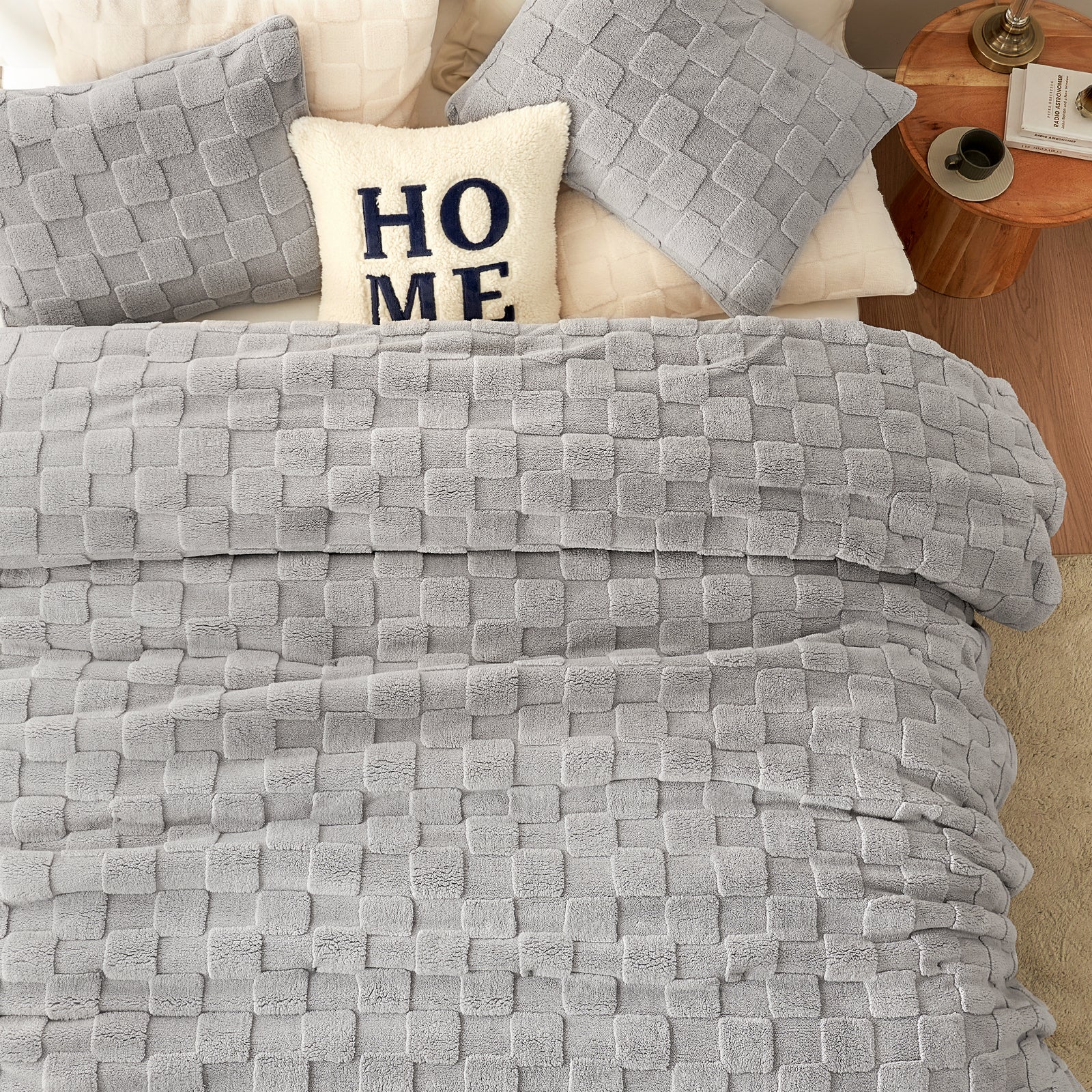 Cozy Bliss gray sherpa comforter set on bed with "HOME" pillow