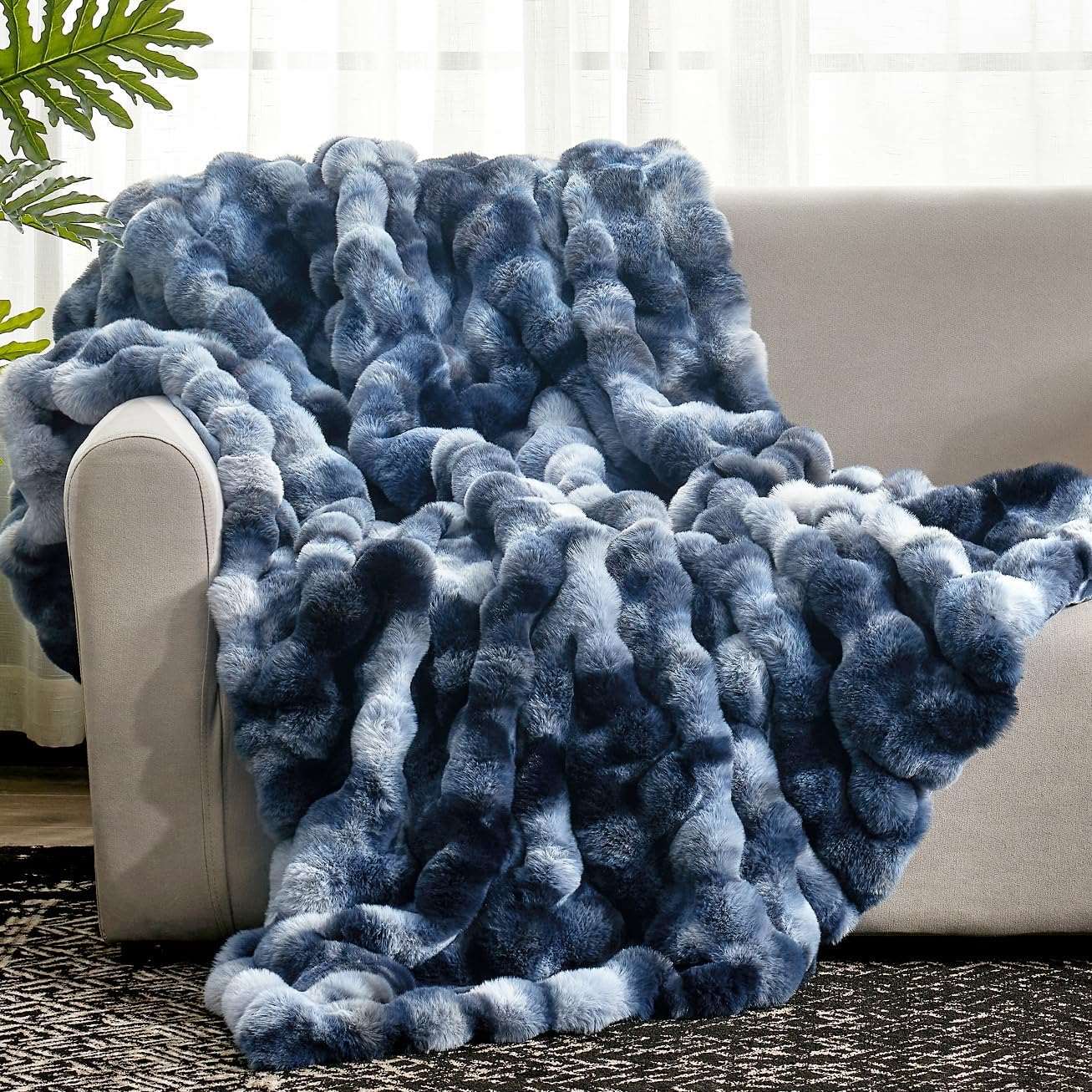 Cozy Bliss Bubble Faux Fur Throw Blanket in blue and gray, draped over sofa for cozy comfort #color_Tie-dye Blue