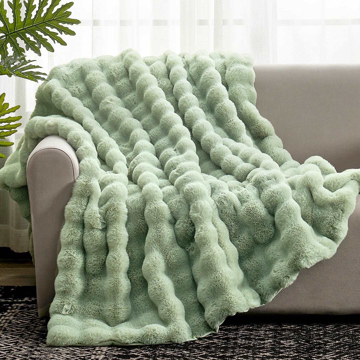 Green Bubble Faux Fur Throw Blanket on a sofa #color_Sage Green