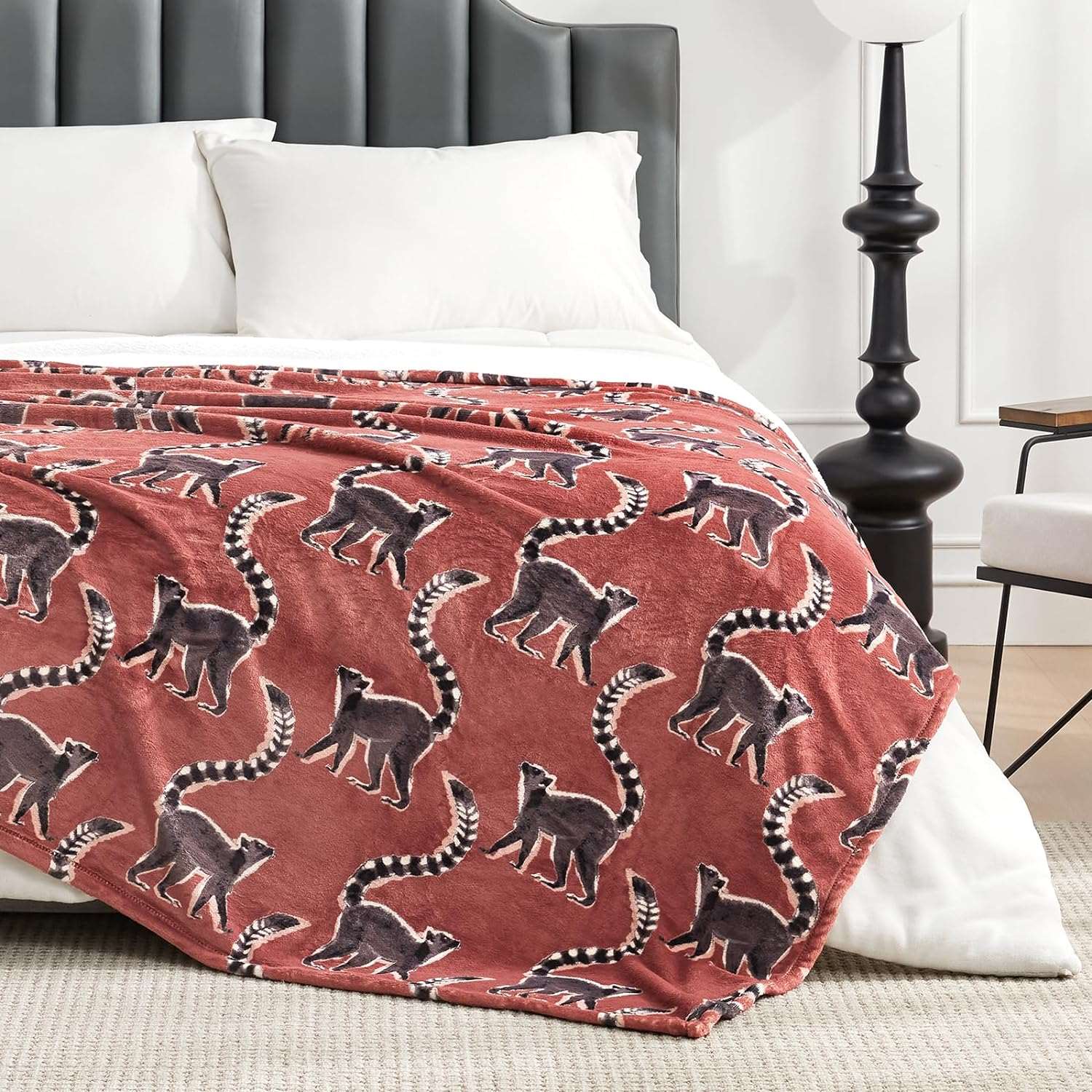 Lemur print fleece reversible blanket on bed #color_Proud Lemur