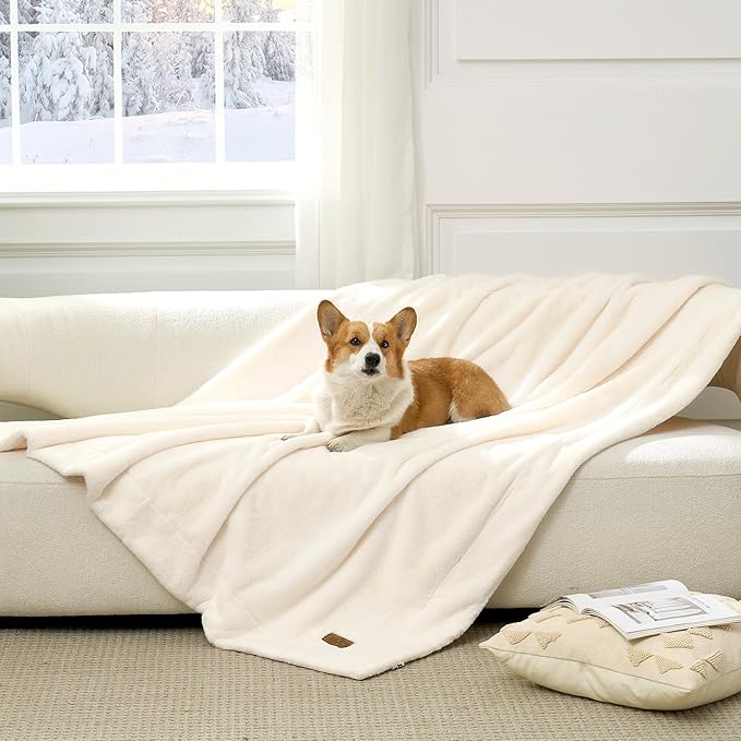 Cozy Bliss Leakproof Faux Fur Pet Blanket in Cream White front view with a dog sitting on it. #color_Cream White