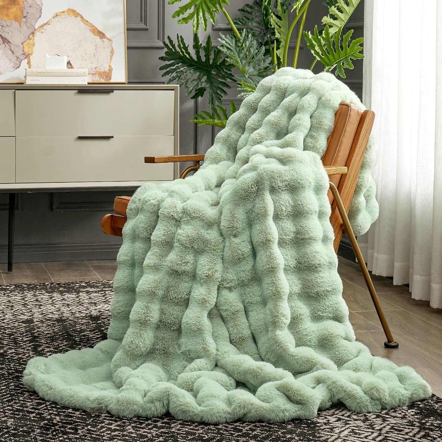 Cozy Bliss sage green bubble faux fur blanket draped over a chair, perfect for adding comfort to any space #color_Sage Green
