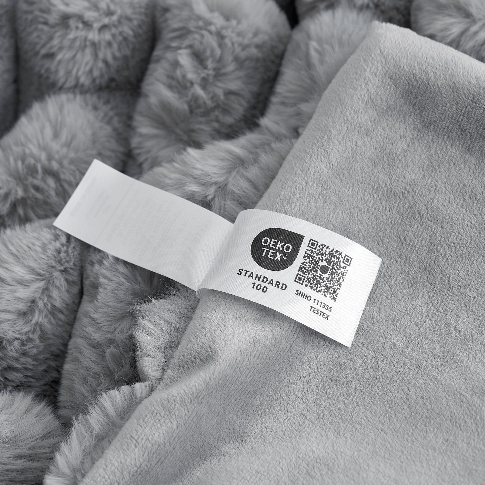 Grey Cozy Bliss faux fur blanket, Oeko-Tex certified, soft and cozy bedding for comfortable relaxation. #color_Grey