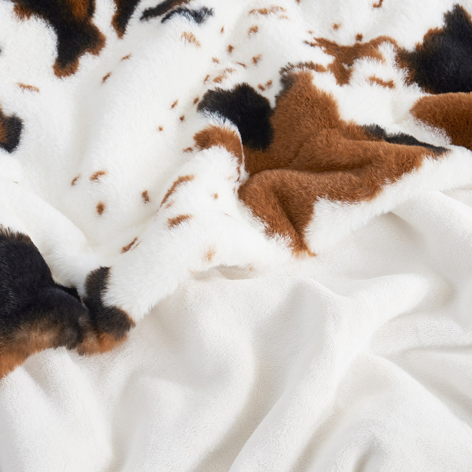 Cow print faux fur blanket, cozy bedding with black, brown and white cow pattern for home decor #color_Black/Brown