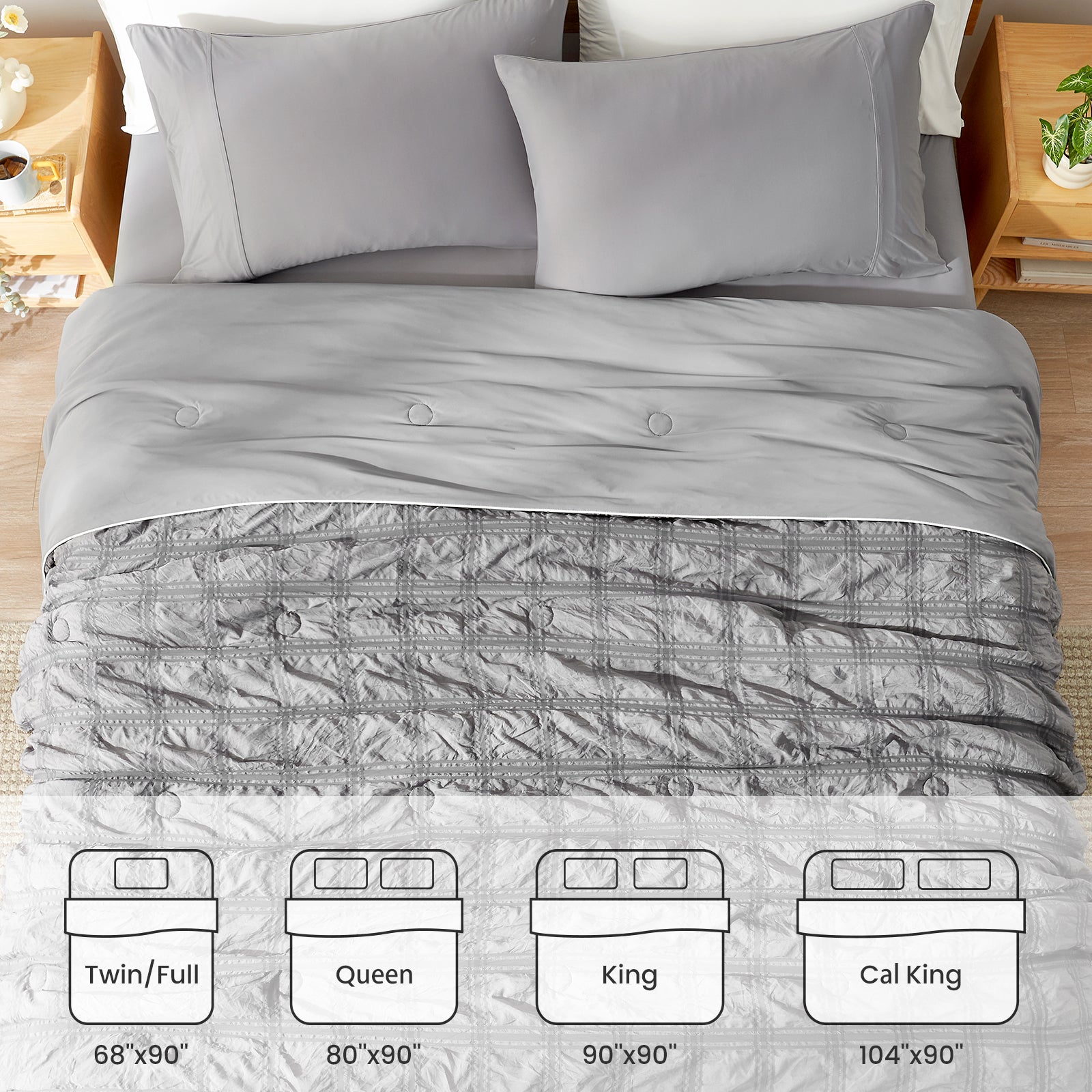 Gray comforter set on a bed with size chart below #color_Dark Gray