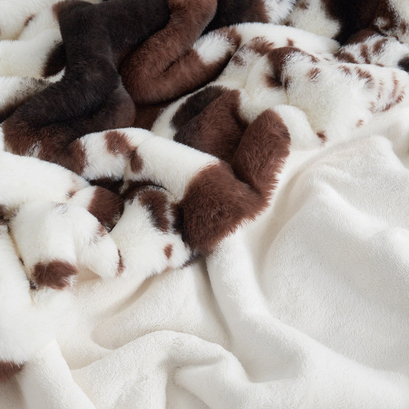 Cow print faux fur blanket, brown and white cow pattern, soft and cozy for home decor and bedding. #color_Black/Coffee