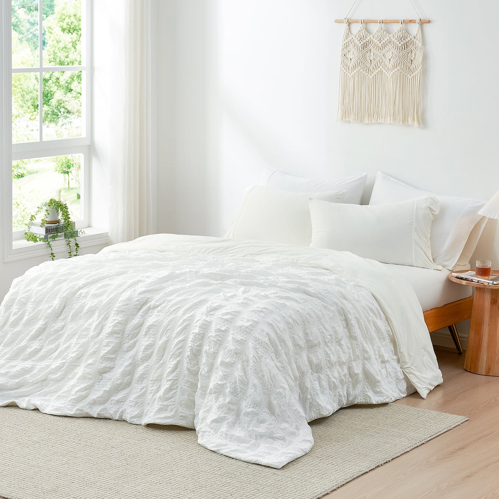 White seersucker cooling comforter on a bed, for a cool sleep experience. #Color_White Plaid