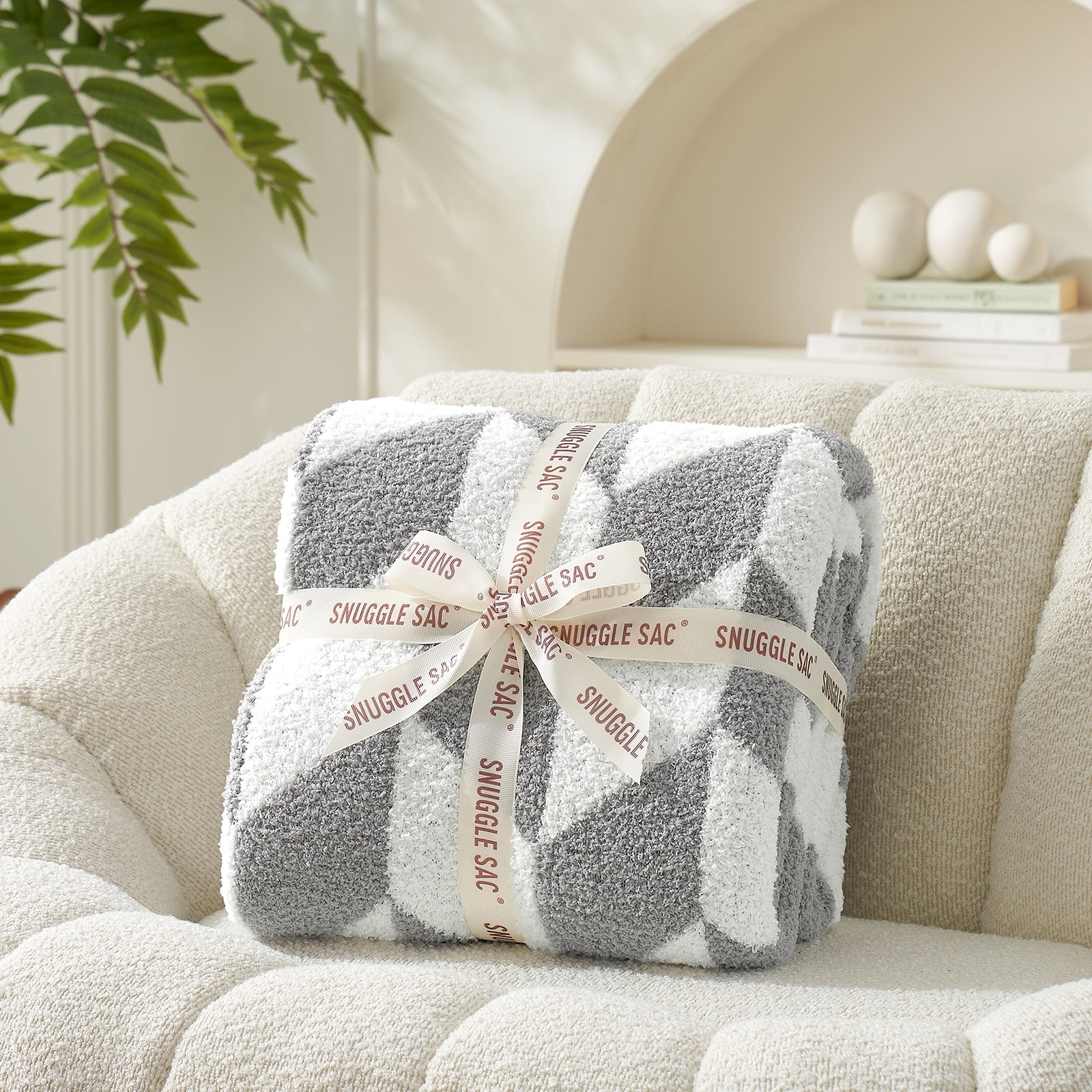 Chevron Feather Yarn Knit Throw Blanket in Grey neatly folded with ribbon packaging, perfect as a cozy gift for holidays and special occasions. #color_Grey
