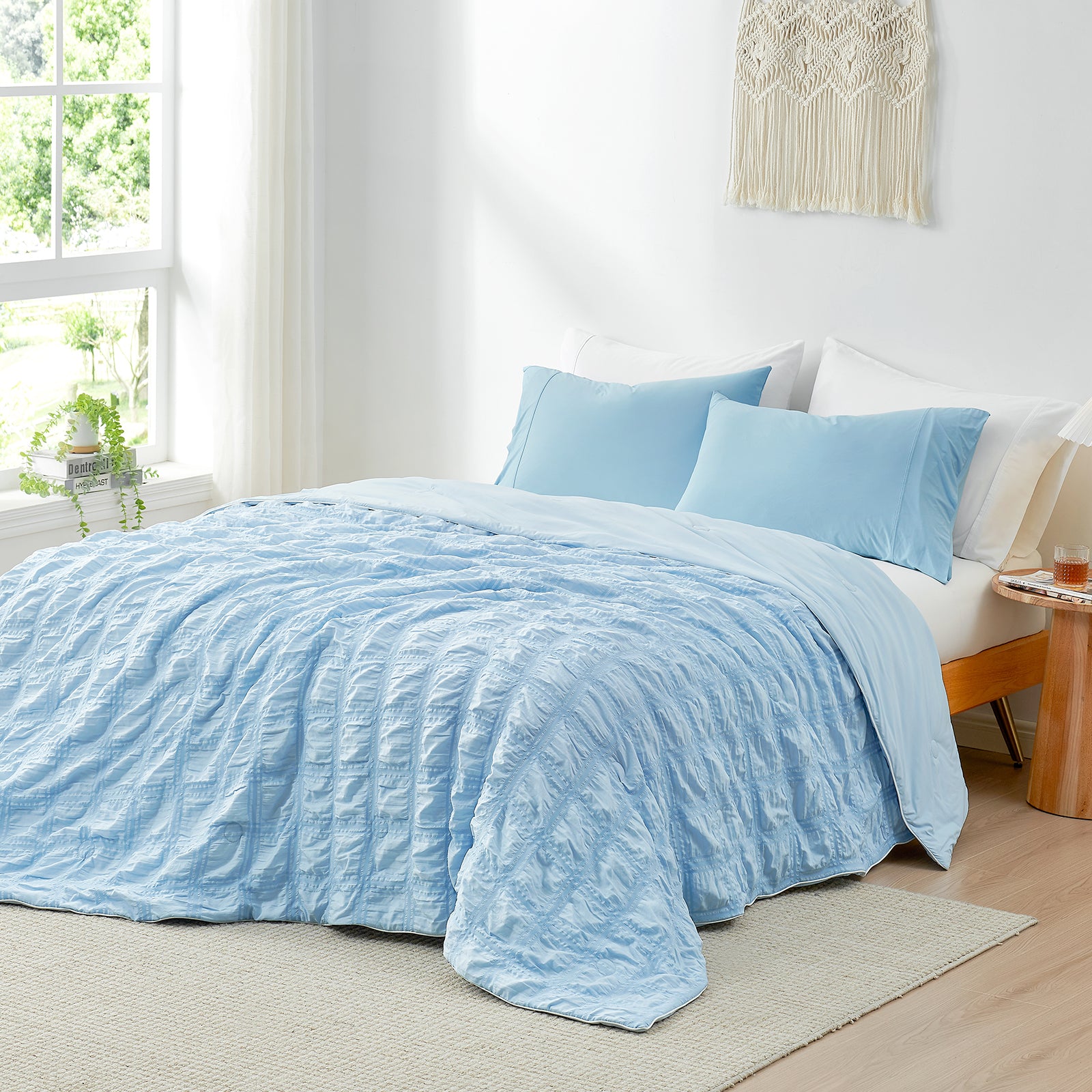 Blue seersucker cooling comforter set on bed #Color_Blue Plaid