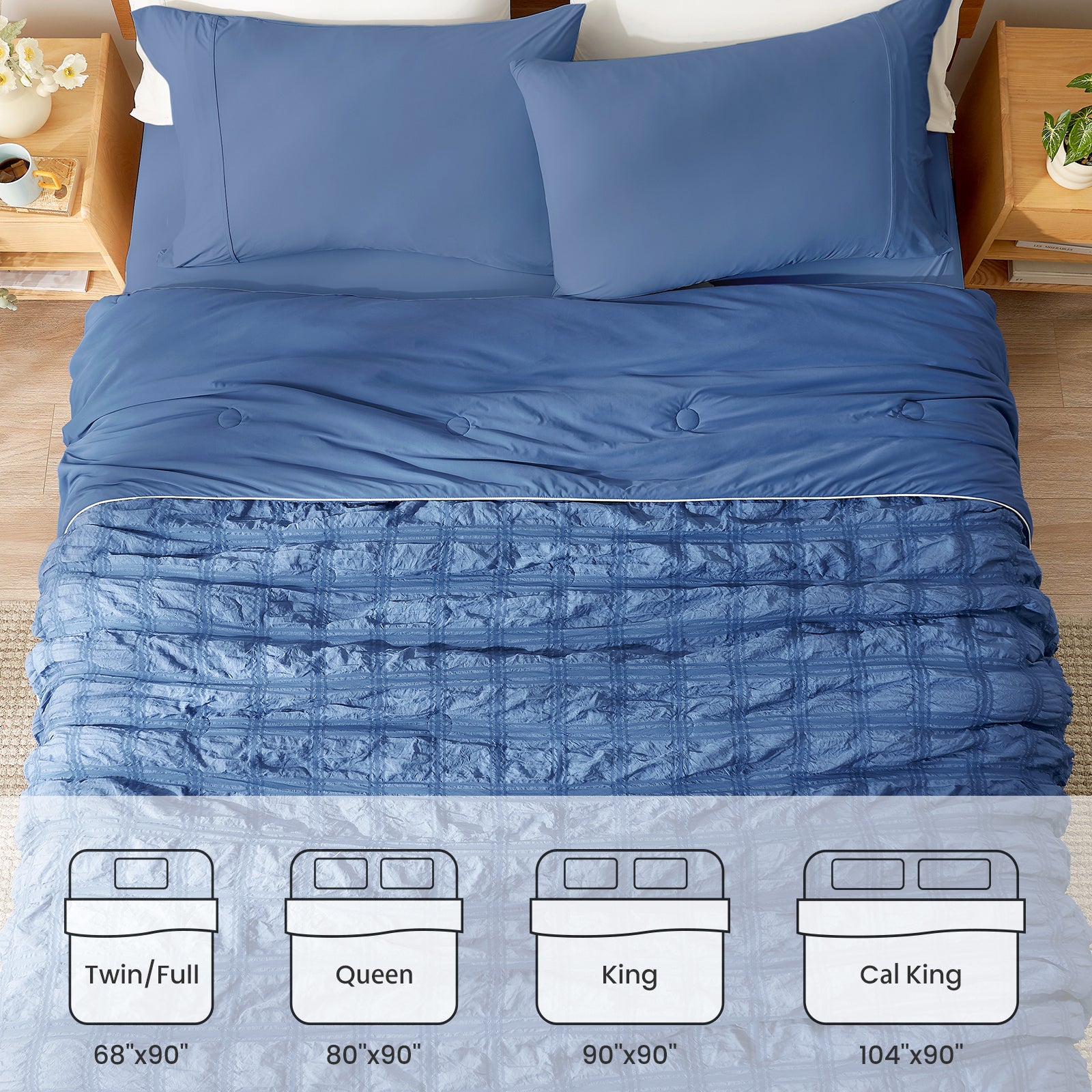 Blue quilted comforter set on a bed with size chart at the bottom. #color_Denim Blue