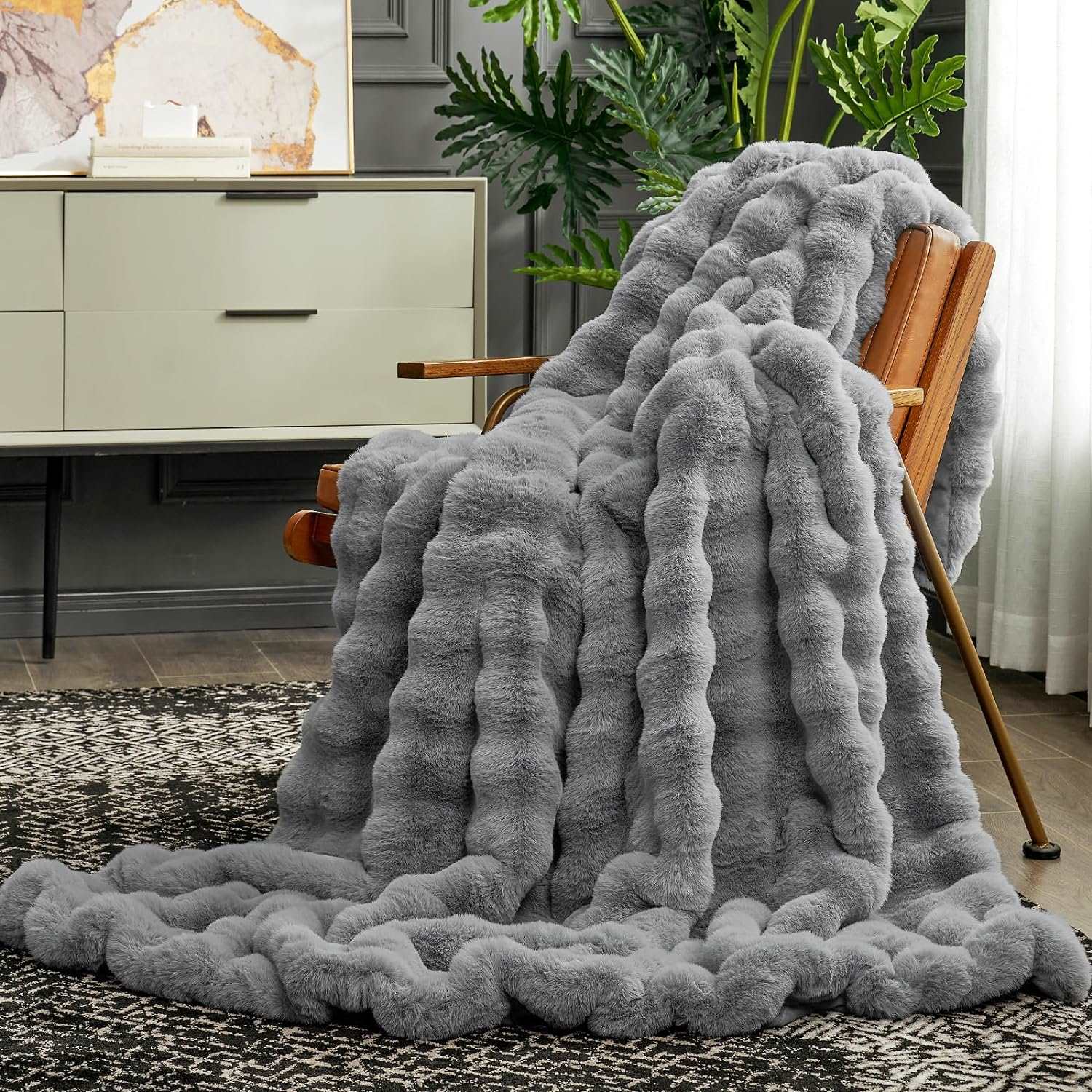 Cozy Bliss gray Bubble Faux Fur Throw Blanket on a wooden chair #color_Grey