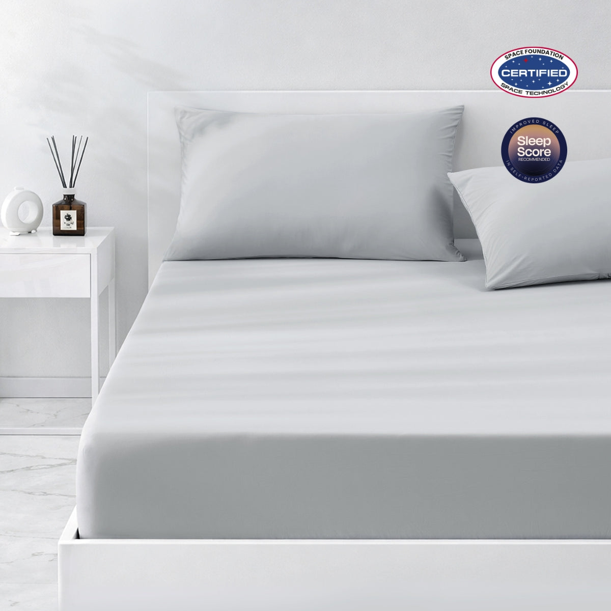 Gray cooling bedding set on a bed in a minimalistic bedroom setting.#color_Cool Grey