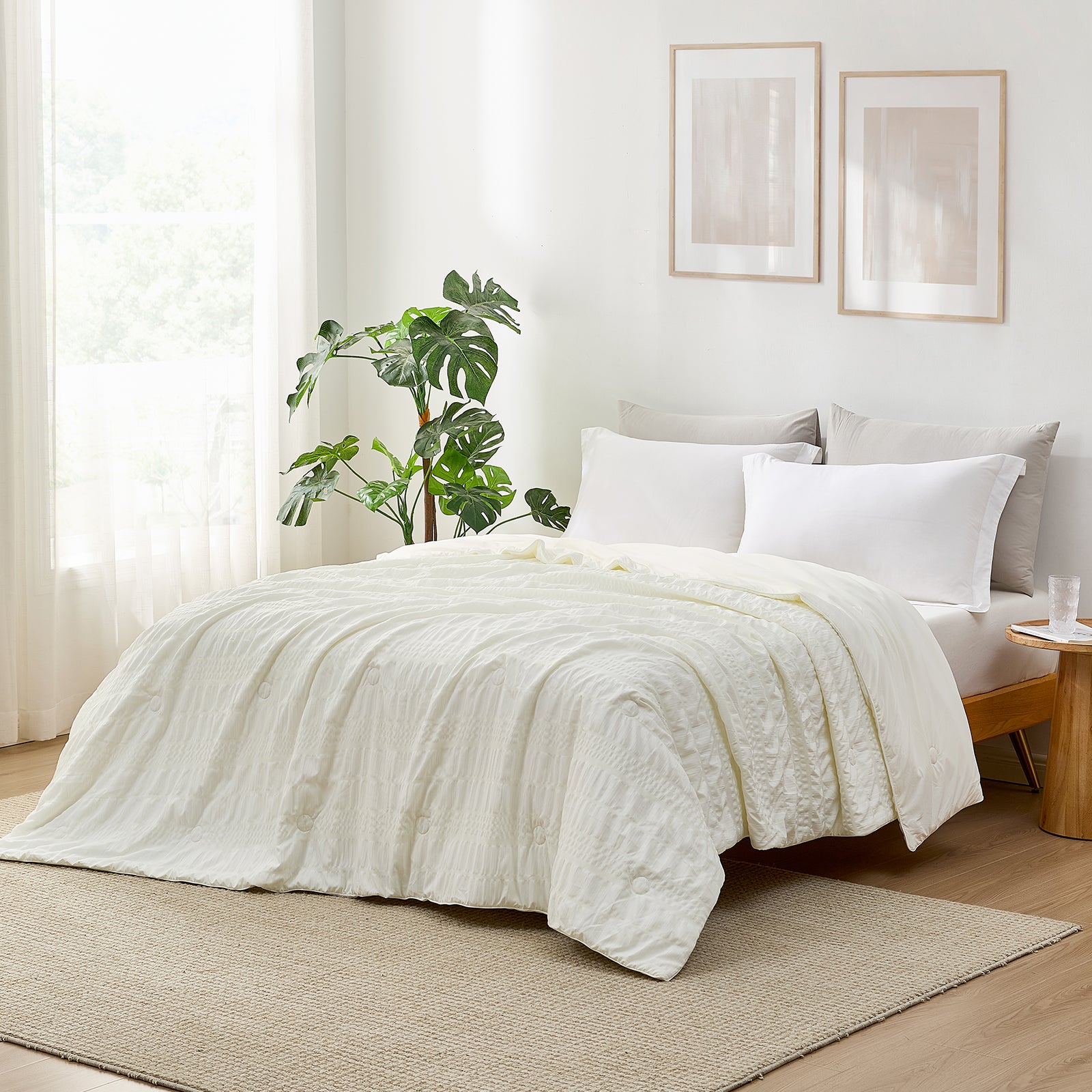 White Seersucker Cooling Comforter on a bed, cozy bedding for a good night's sleep #color_Cream White