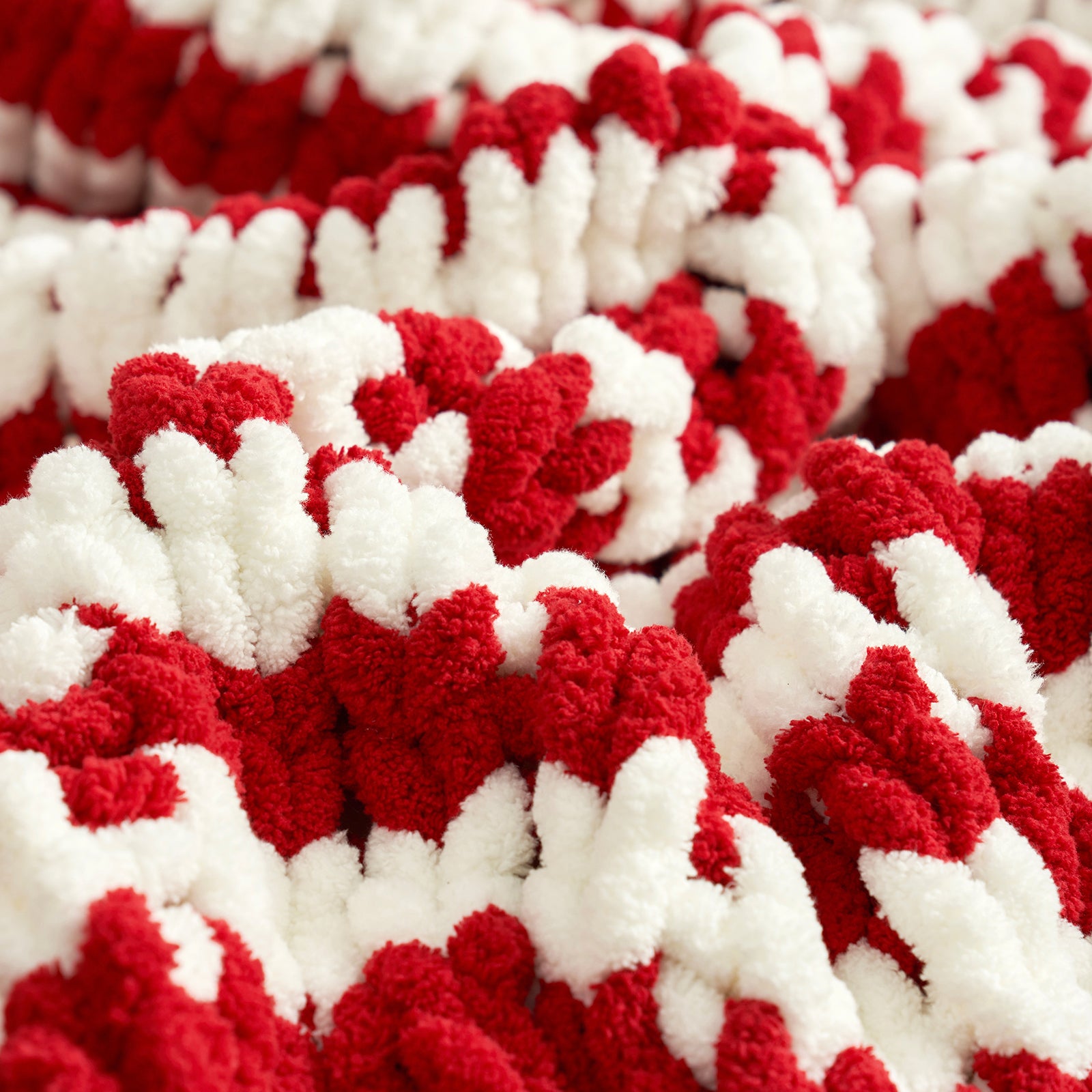 Close-up of a red and white textured fabric pattern #Color_Red